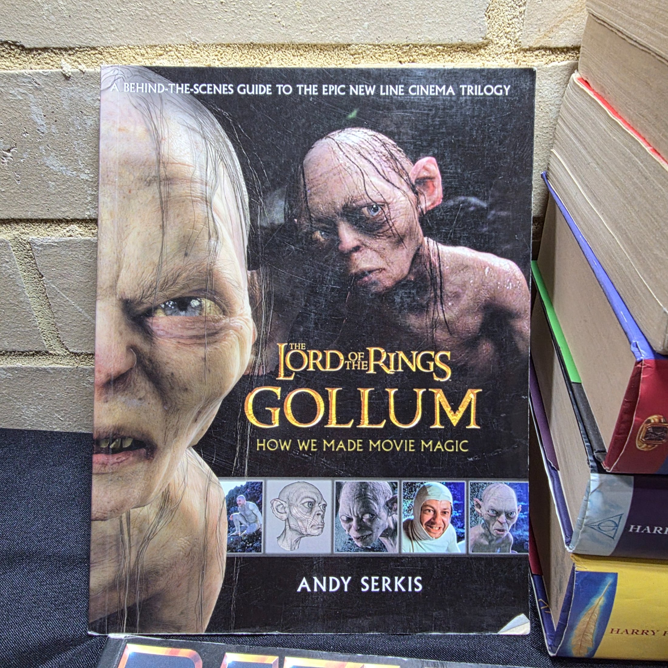 A collection of popular culture books, including a complete set of seven Harry Potter novels and various movie companion books like 'The Making of 007 Tomorrow Never Dies' and 'The Lord of the Rings Gollum'. - View 4