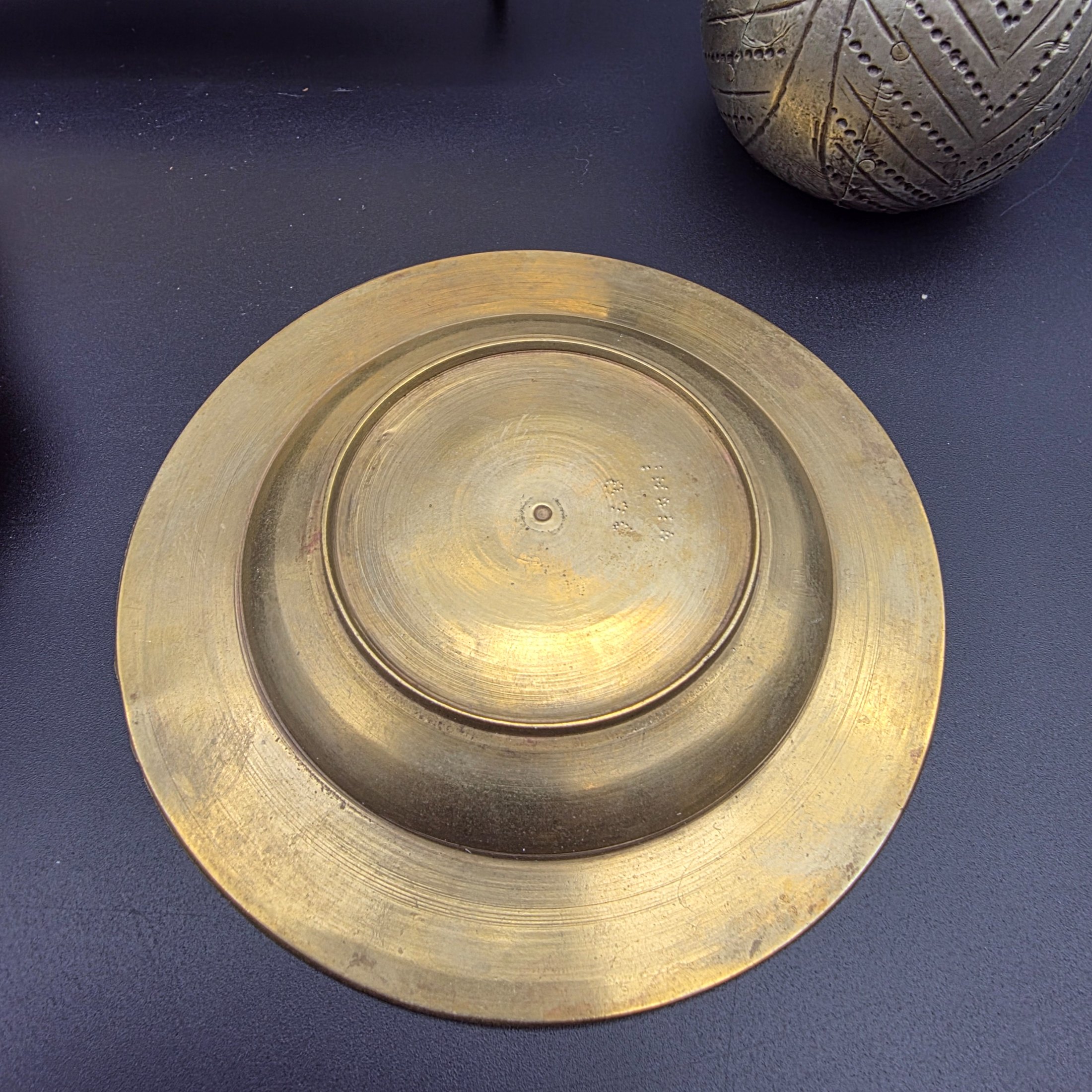 A collection of five vintage engraved brass and bronze decorative items, including three ashtrays, a vase, and a pear-shaped container. - View 4