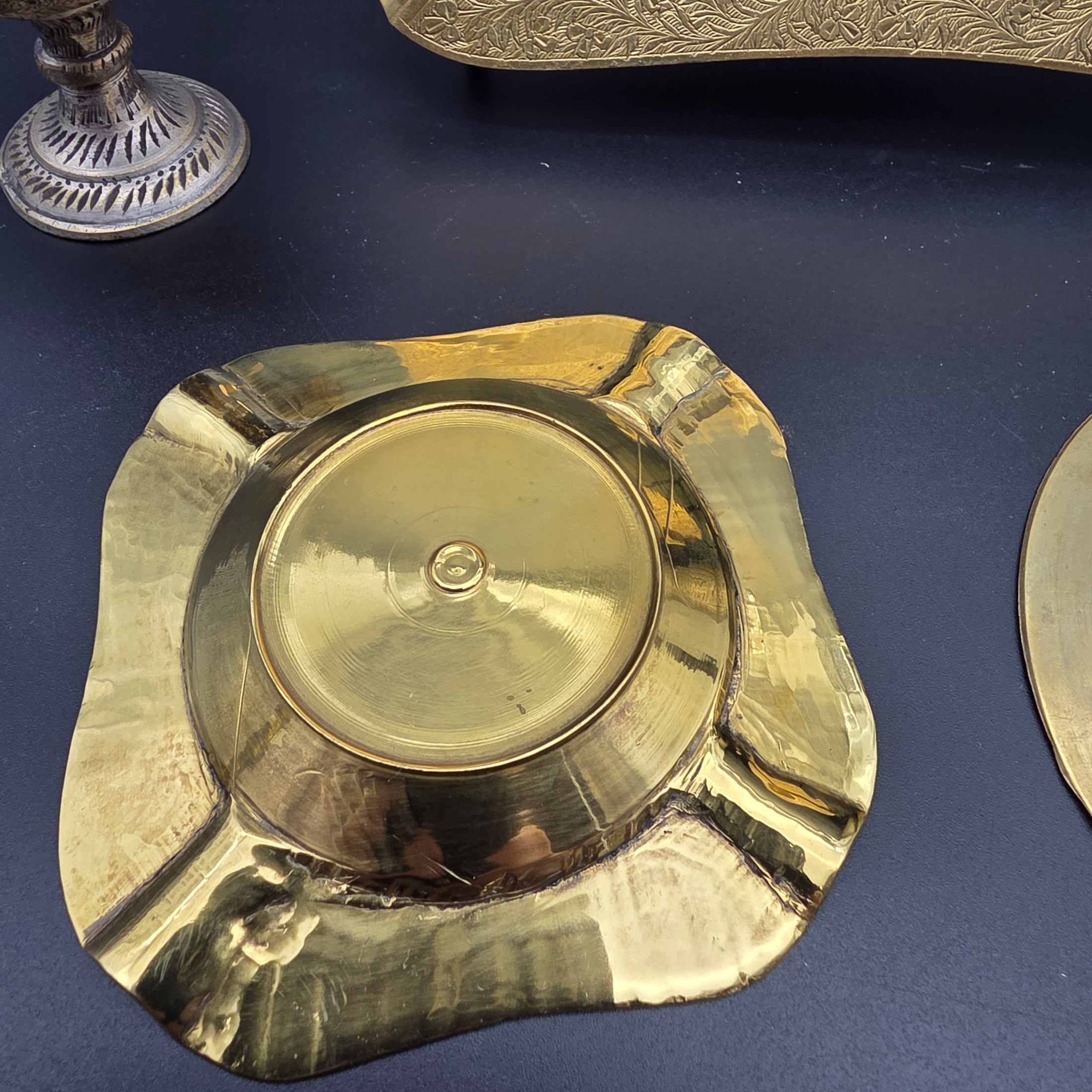 A collection of five vintage engraved brass and bronze decorative items, including three ashtrays, a vase, and a pear-shaped container. - View 6