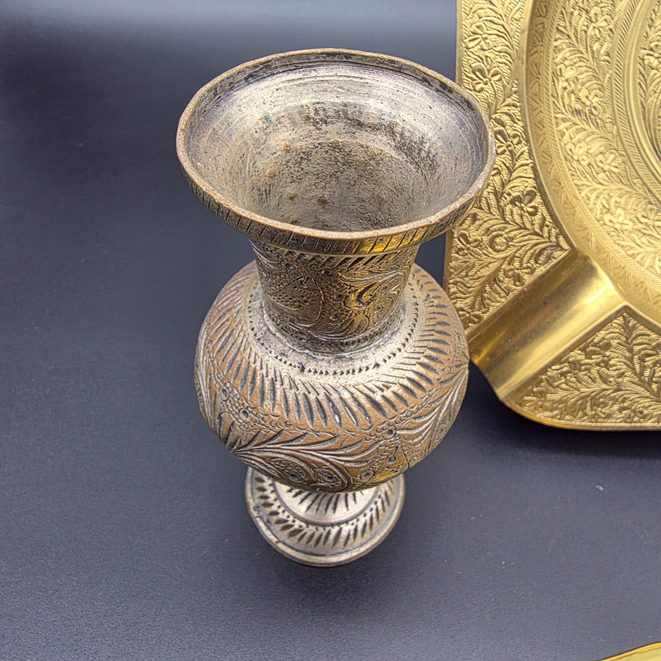 A collection of five vintage engraved brass and bronze decorative items, including three ashtrays, a vase, and a pear-shaped container. - View 7