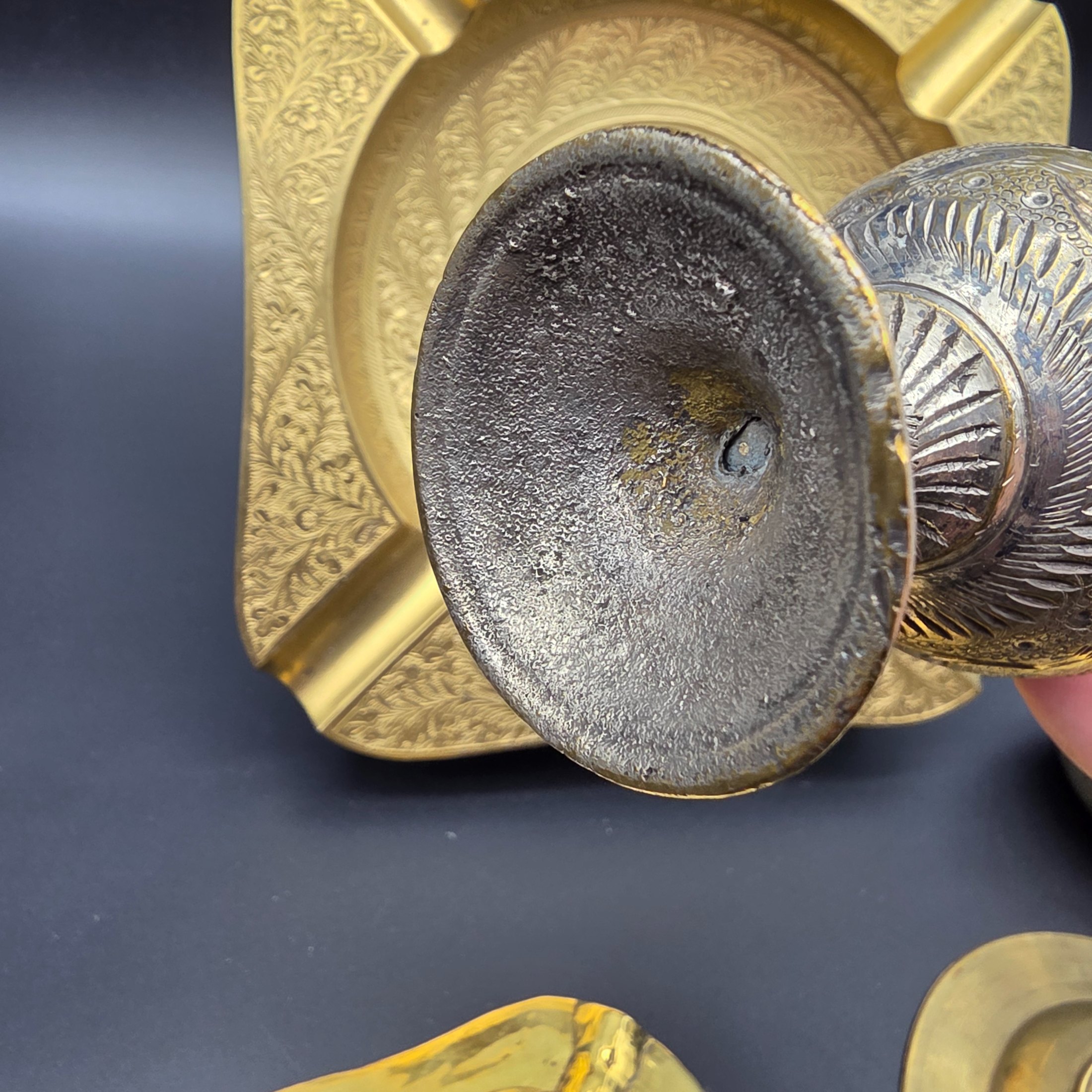 A collection of five vintage engraved brass and bronze decorative items, including three ashtrays, a vase, and a pear-shaped container. - View 8