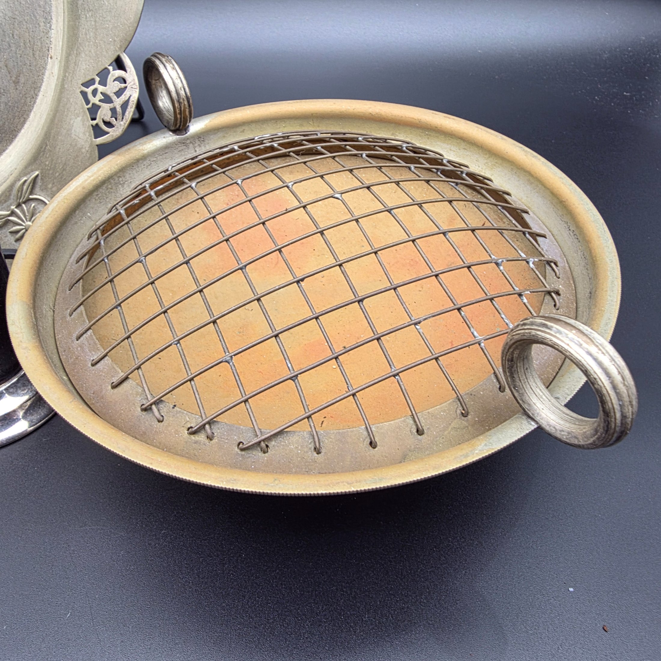 A varied collection of vintage homewares crafted from Britex Electroplated Britannia Metal (E.P.B.M.), 'Made in England', including trays, a pitcher, bowls, and a candelabra, all exhibiting significant tarnishing. - View 6