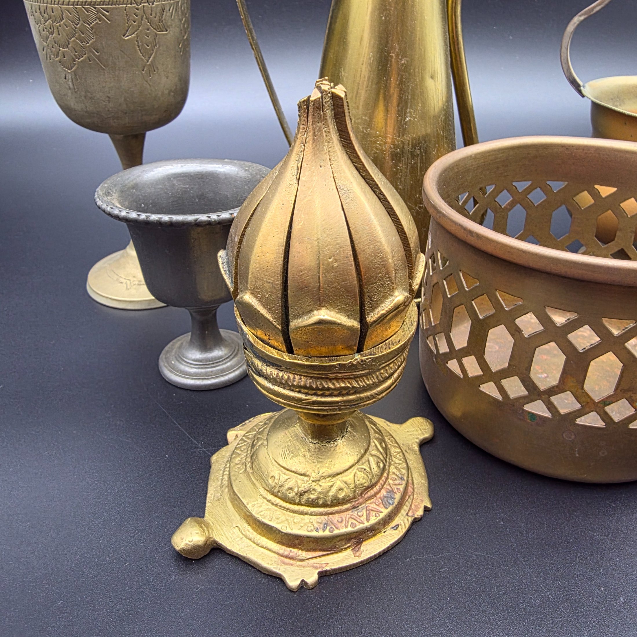 A varied collection of vintage brass and copper metalware, featuring decorative and functional items for home display. - View 2