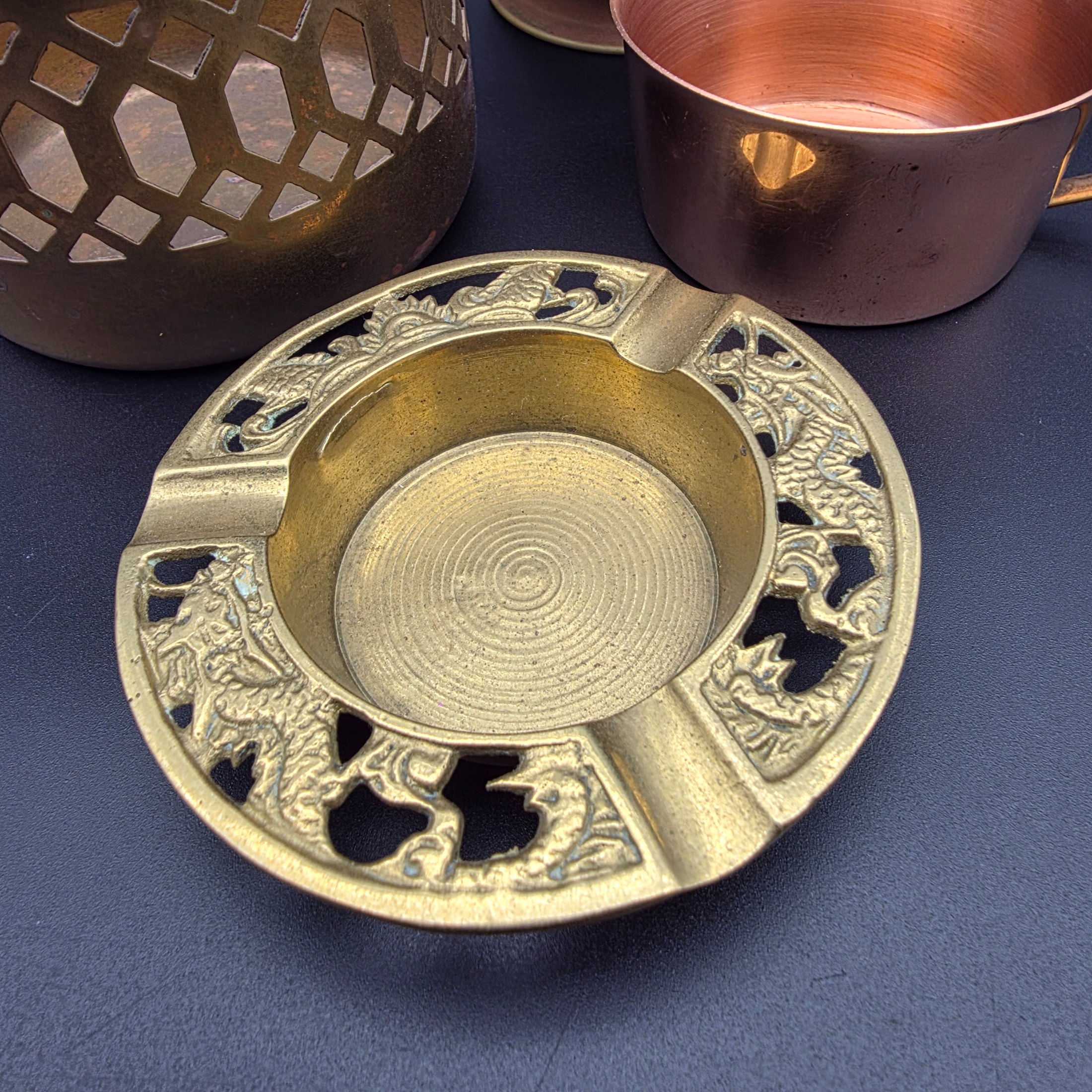 A varied collection of vintage brass and copper metalware, featuring decorative and functional items for home display. - View 4