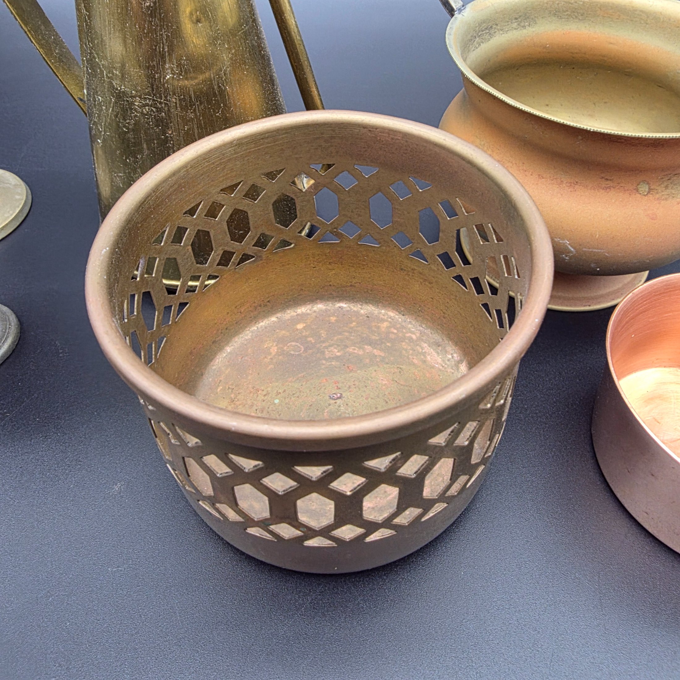 A varied collection of vintage brass and copper metalware, featuring decorative and functional items for home display. - View 5