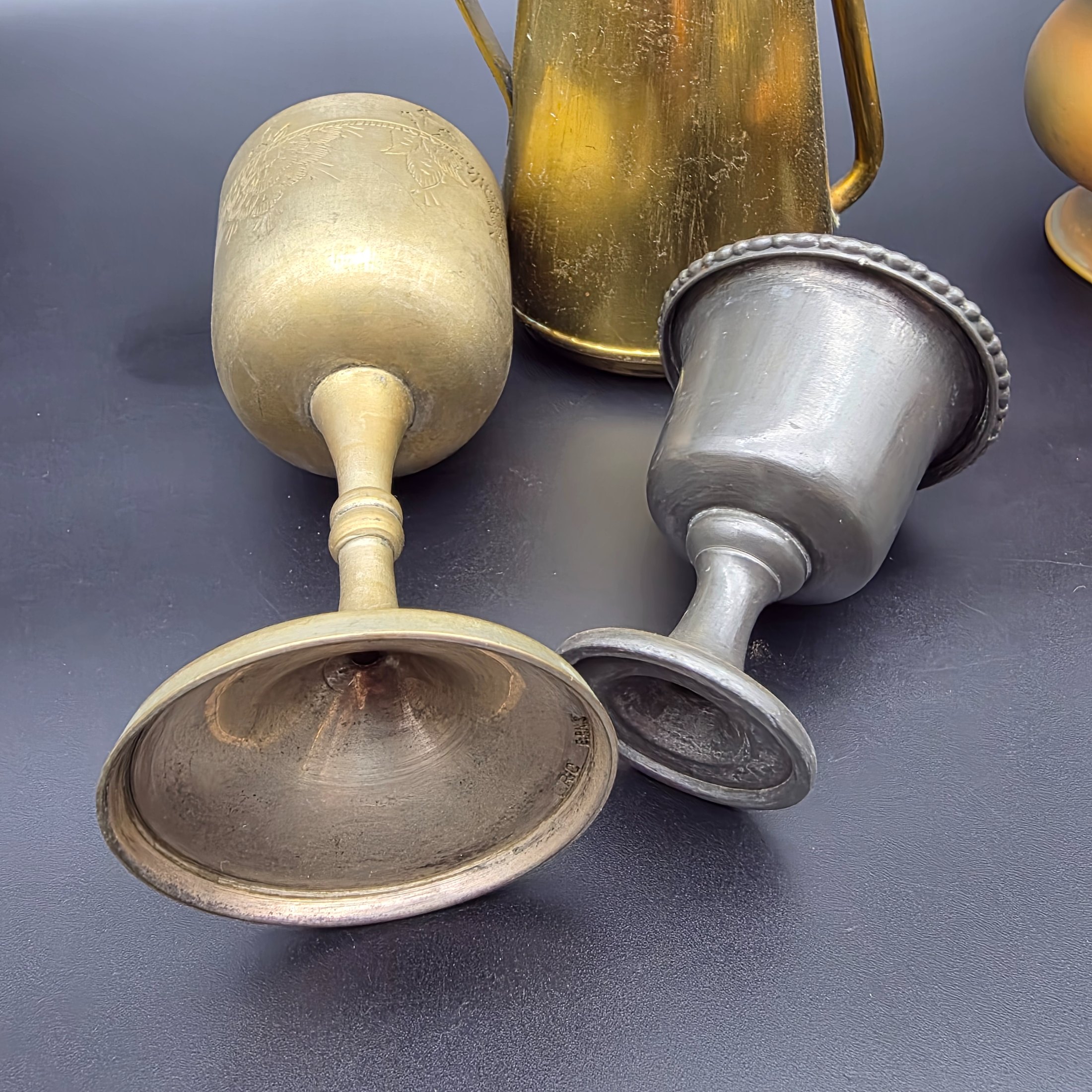 A varied collection of vintage brass and copper metalware, featuring decorative and functional items for home display. - View 8