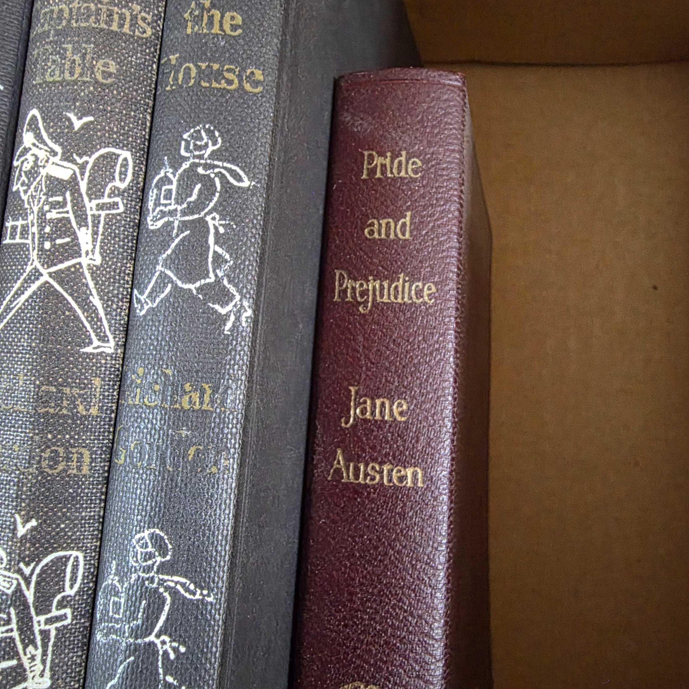 A diverse collection of vintage hardcover novels, including works by prominent authors like Georgette Heyer, Richard Gordon, and Jane Austen, predominantly from the mid-20th century. - View 2