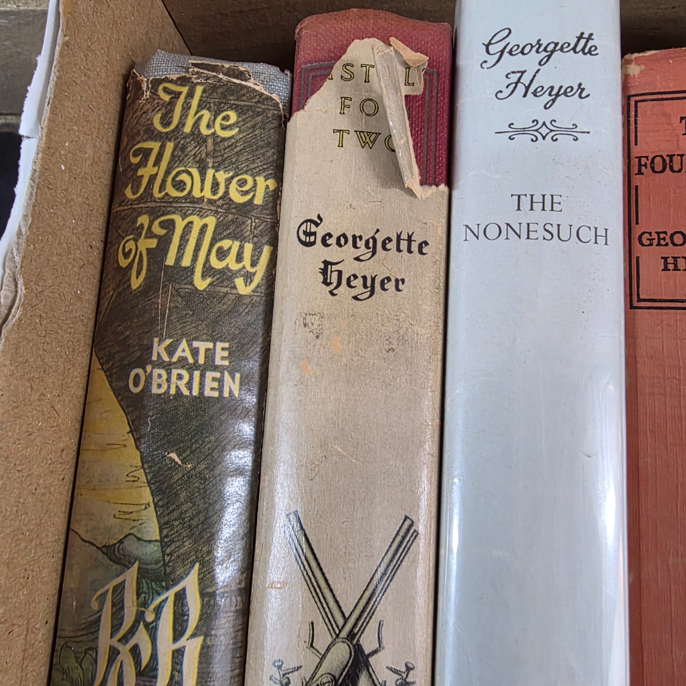 A diverse collection of vintage hardcover novels, including works by prominent authors like Georgette Heyer, Richard Gordon, and Jane Austen, predominantly from the mid-20th century. - View 5