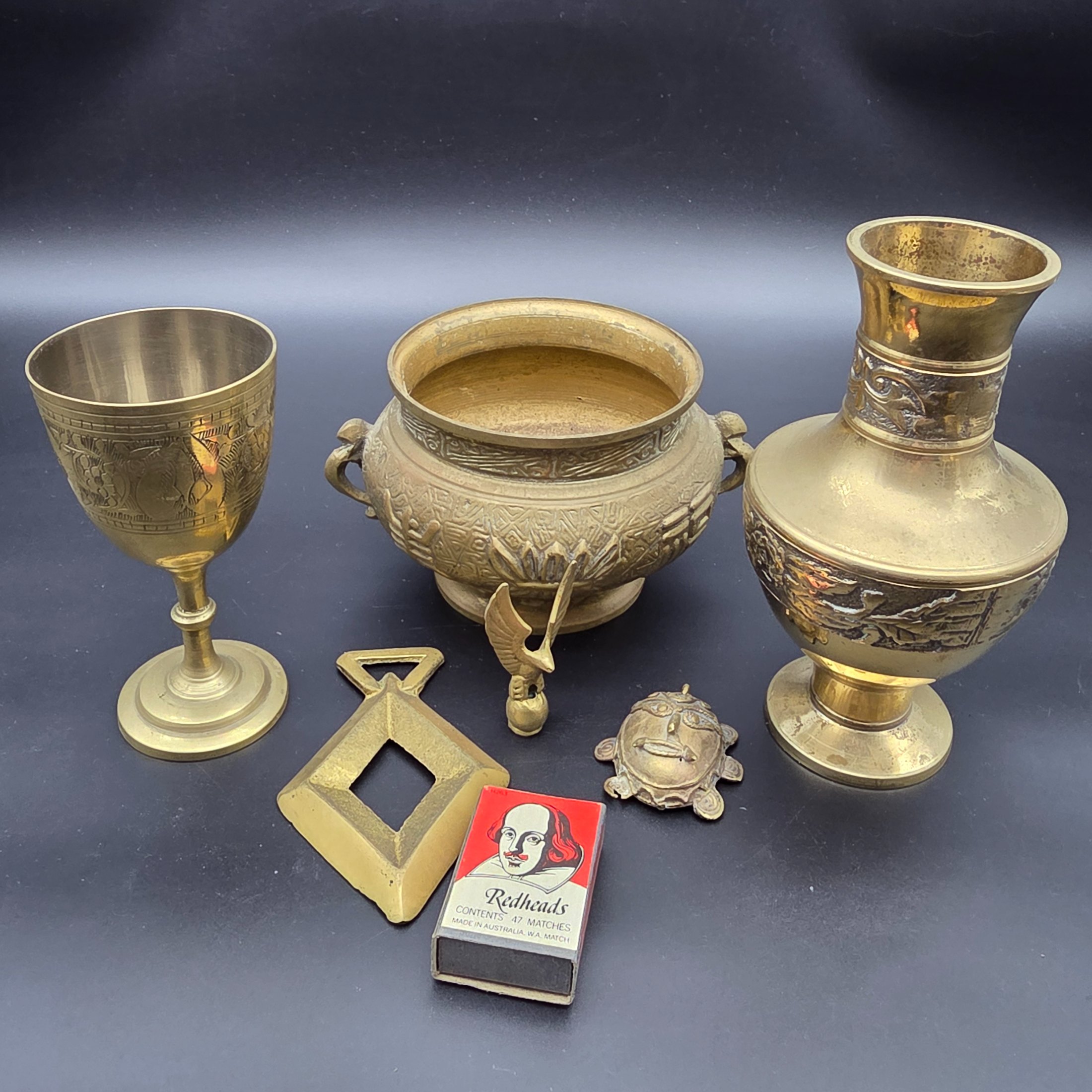 A collection of five assorted vintage brass ornamental pieces, including a goblet, vase, censer, and two smaller decorative items, all featuring intricate etchings and cast details. - View 2