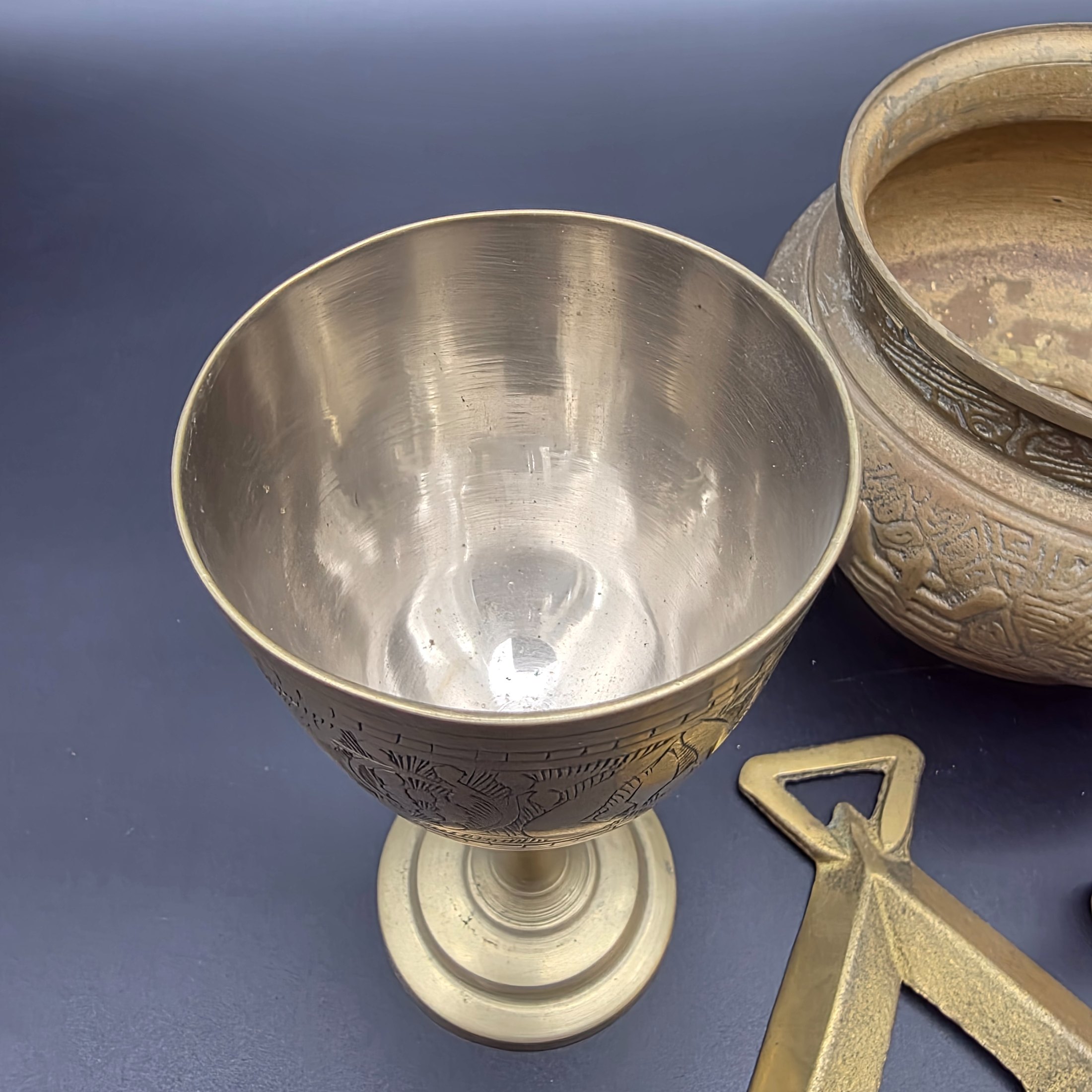 A collection of five assorted vintage brass ornamental pieces, including a goblet, vase, censer, and two smaller decorative items, all featuring intricate etchings and cast details. - View 4
