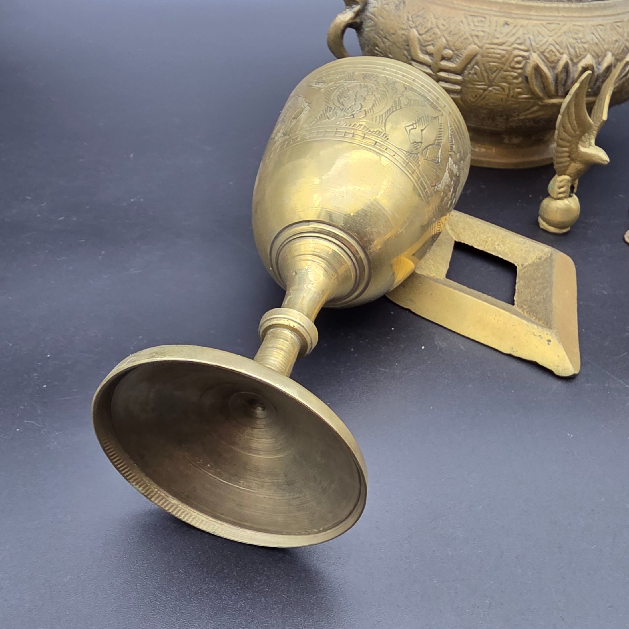A collection of five assorted vintage brass ornamental pieces, including a goblet, vase, censer, and two smaller decorative items, all featuring intricate etchings and cast details. - View 5