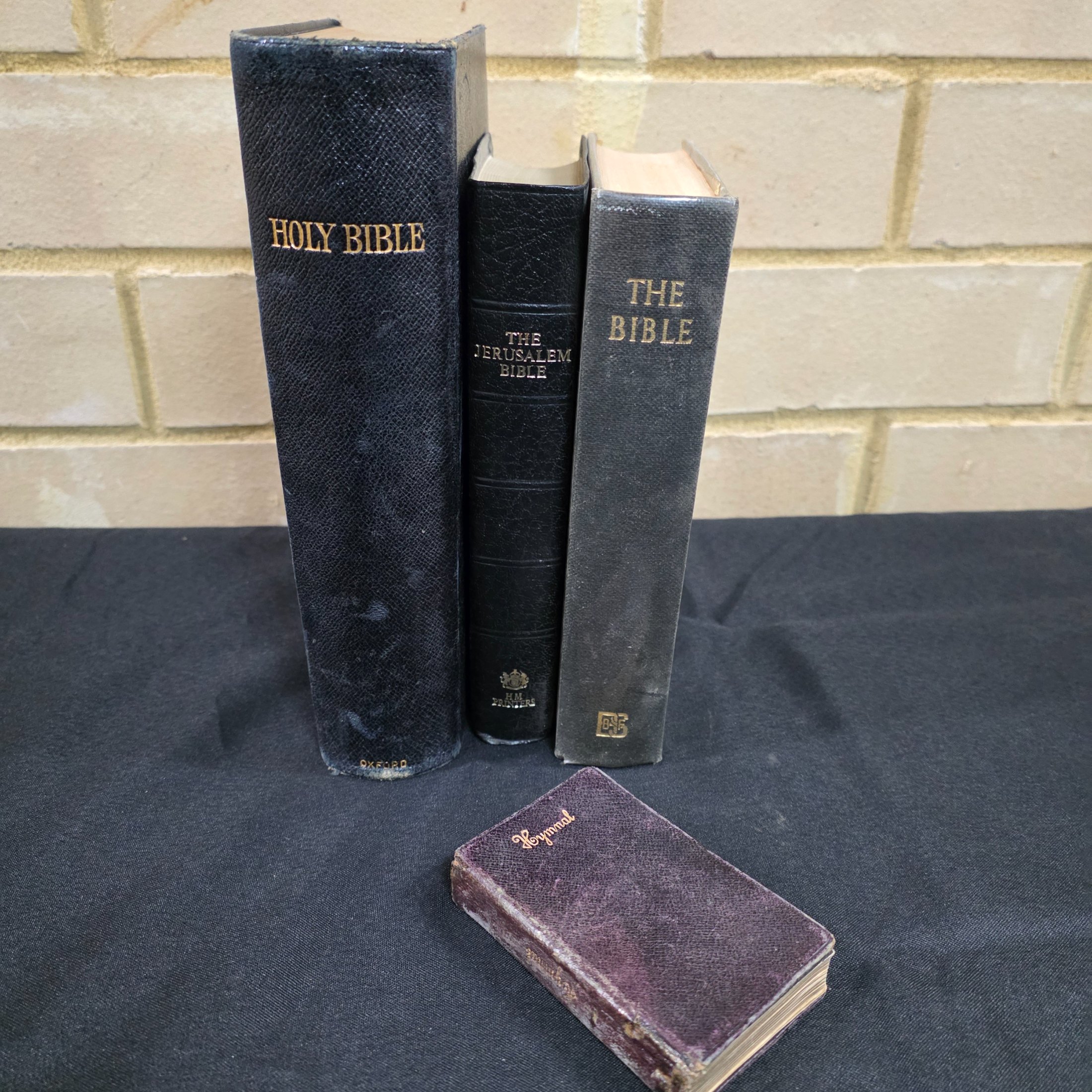 Lot of Four Vintage Religious Texts: Holy Bibles and Hymnal Companion — Lot 139, photograph 1