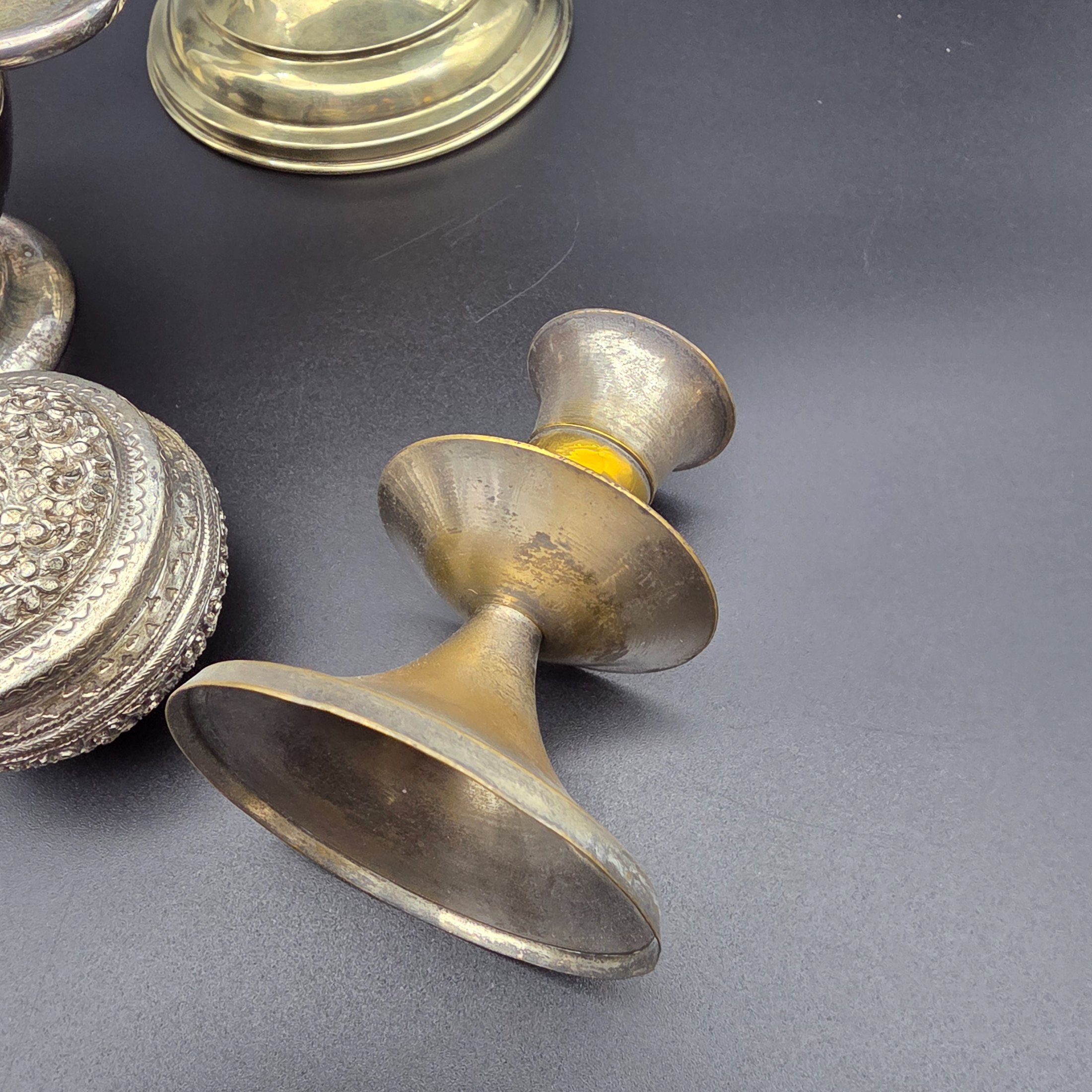 A diverse collection of antique and vintage metalware, primarily silver-plated and brass, featuring a variety of decorative and functional household items from the early to mid-20th century. - View 7