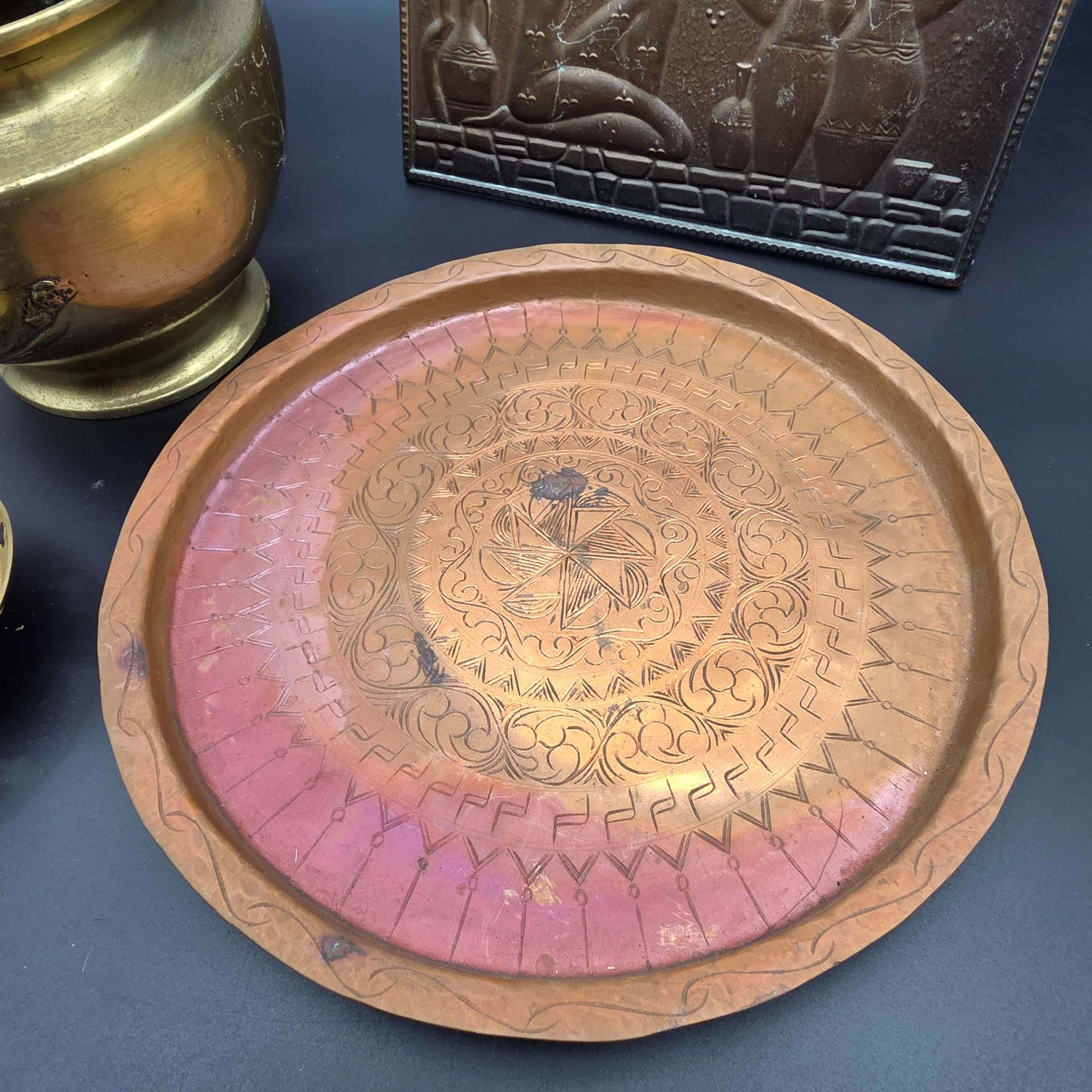 A lot of vintage decorative metalware comprising various brass and copper items, showcasing embossed and etched designs. - View 2