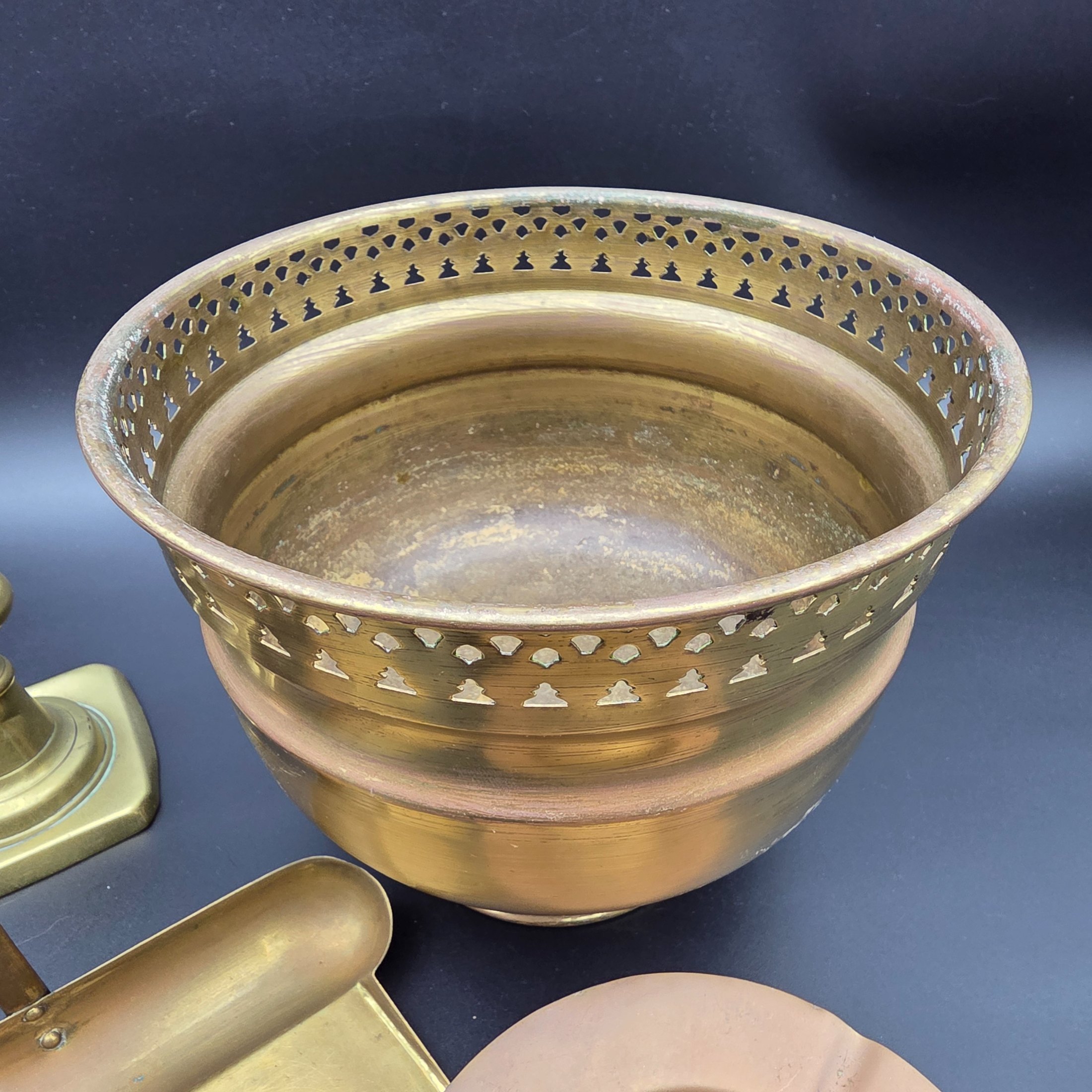 A collection of vintage metal home decor and utility items, featuring brass and copper pieces from the mid-20th century, including a planter, candlestick, crumb tray, copper dish, and ashtray. - View 3