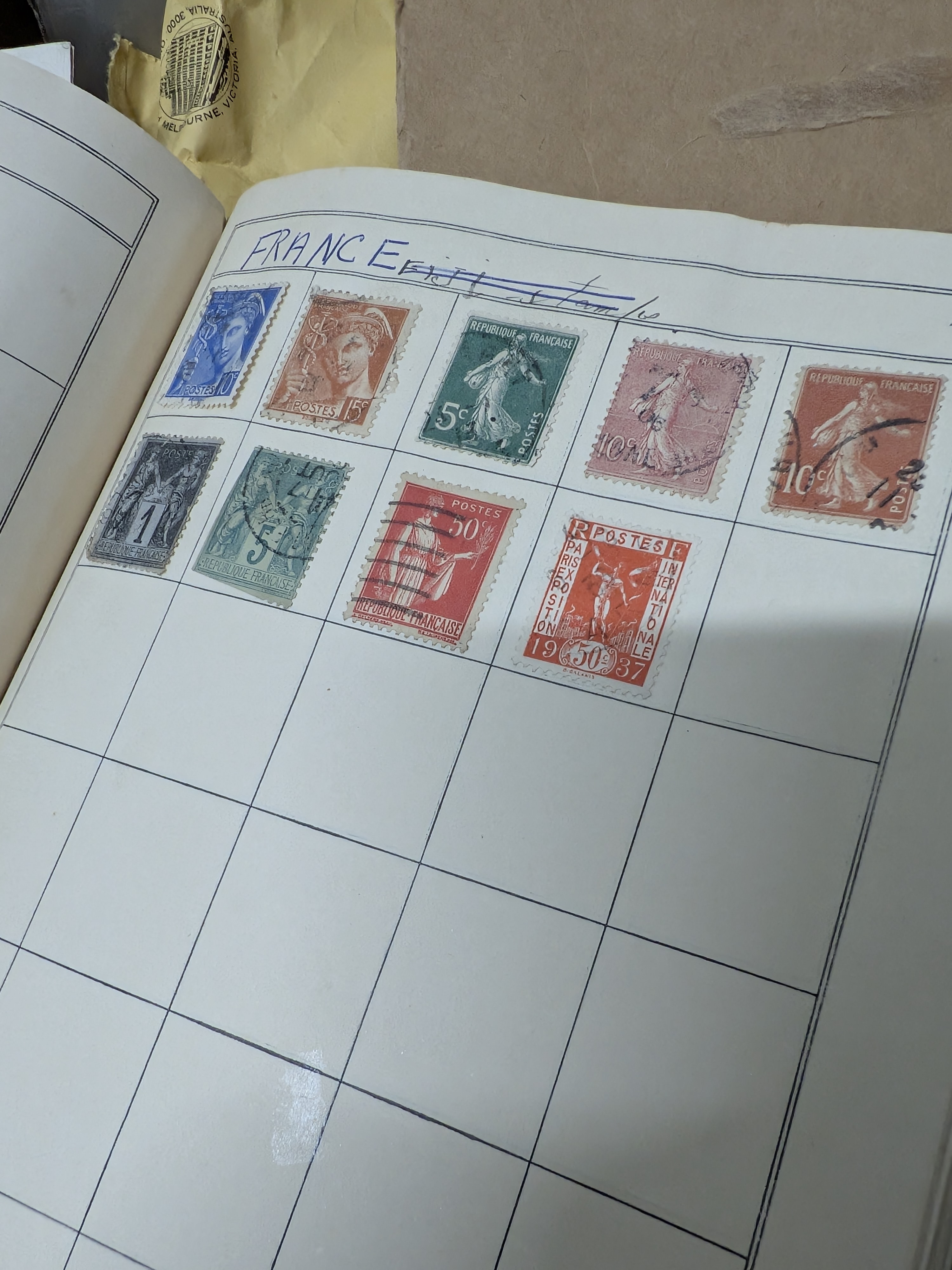 A substantial box lot containing a diverse collection of Australian and international postage stamps, housed in various albums and loose. - View 7