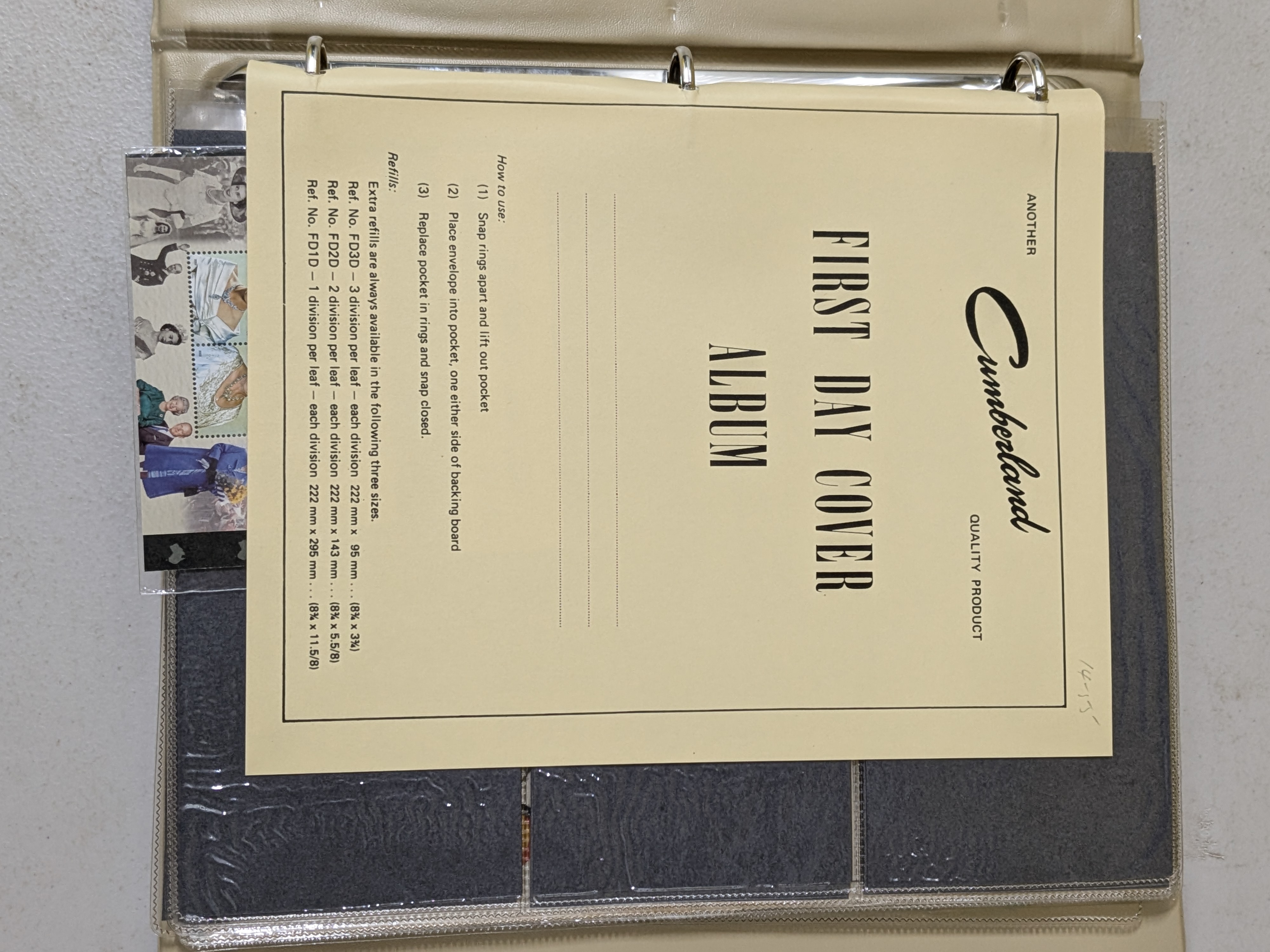 A dark brown, leatherette-bound album containing a collection of Australian First Day Covers, primarily from the mid to late 20th century. - View 2