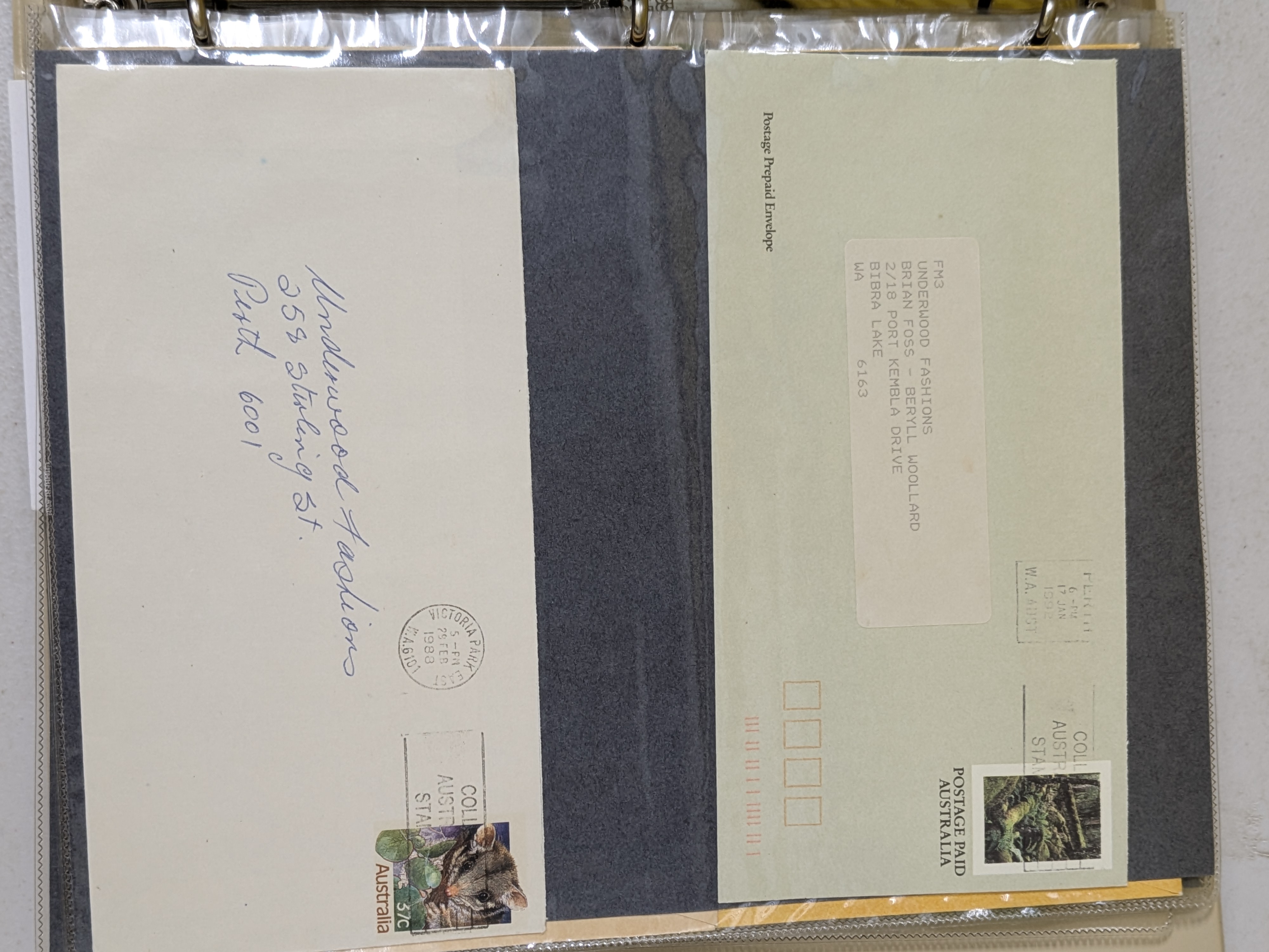 A dark brown, leatherette-bound album containing a collection of Australian First Day Covers, primarily from the mid to late 20th century. - View 6
