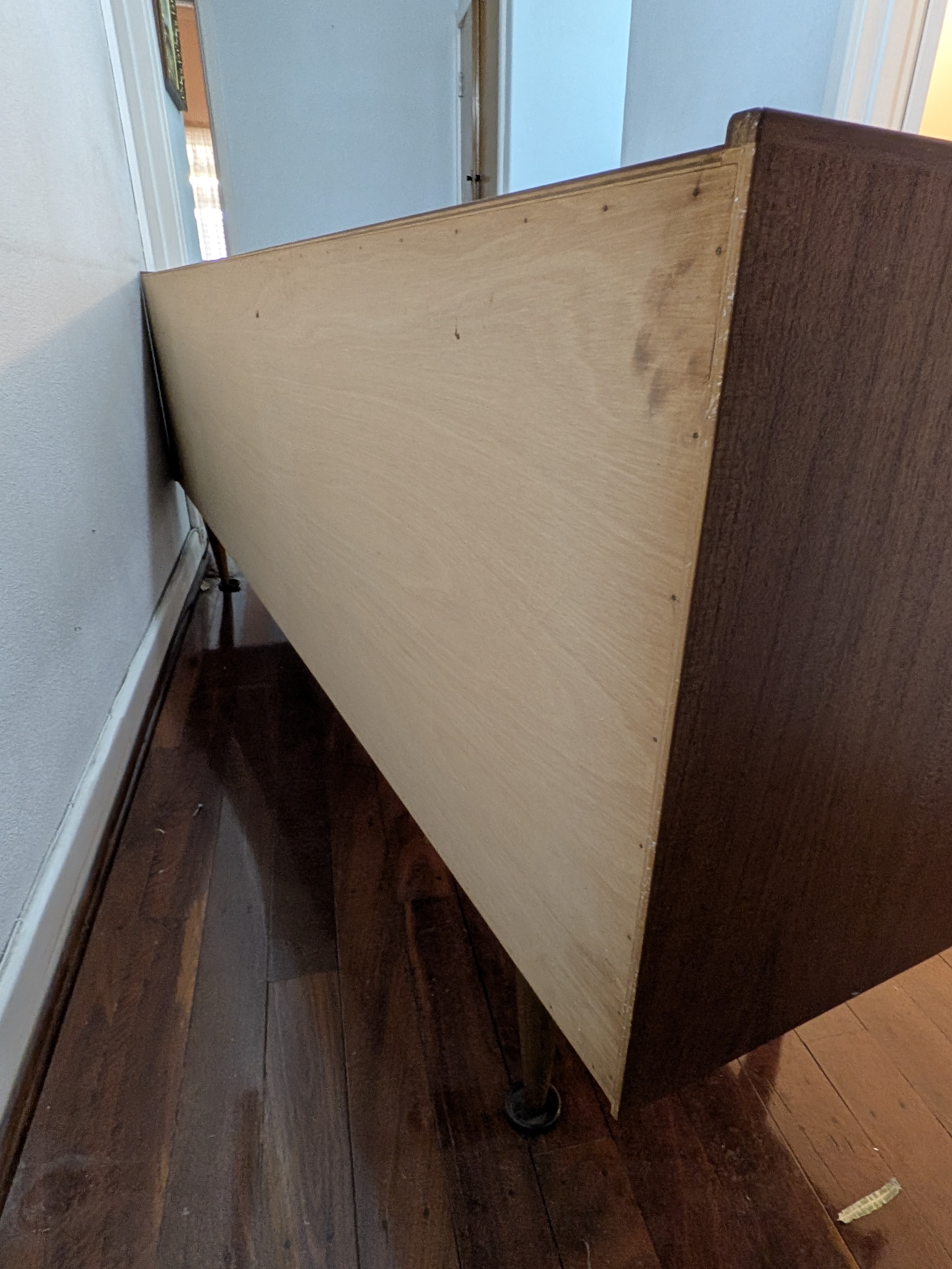 A classic Mid-Century Modern credenza, crafted from rich teak veneer with a warm, inviting tone, circa 1960s. This elegant piece features clean lines and functional design. - View 5