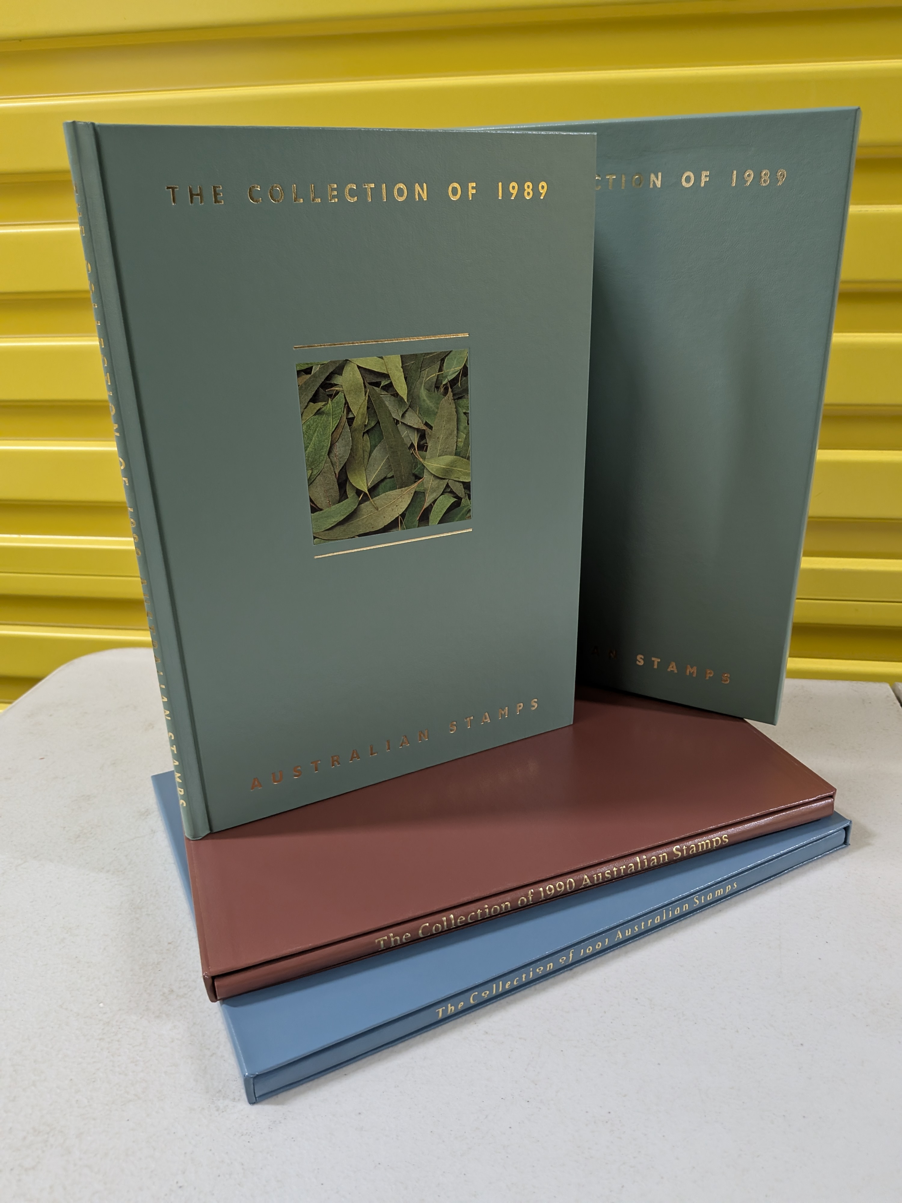 Set of Three: 'The Collection of Australian Stamps' Annual Albums (1989, 1990, 1991) — Lot 100