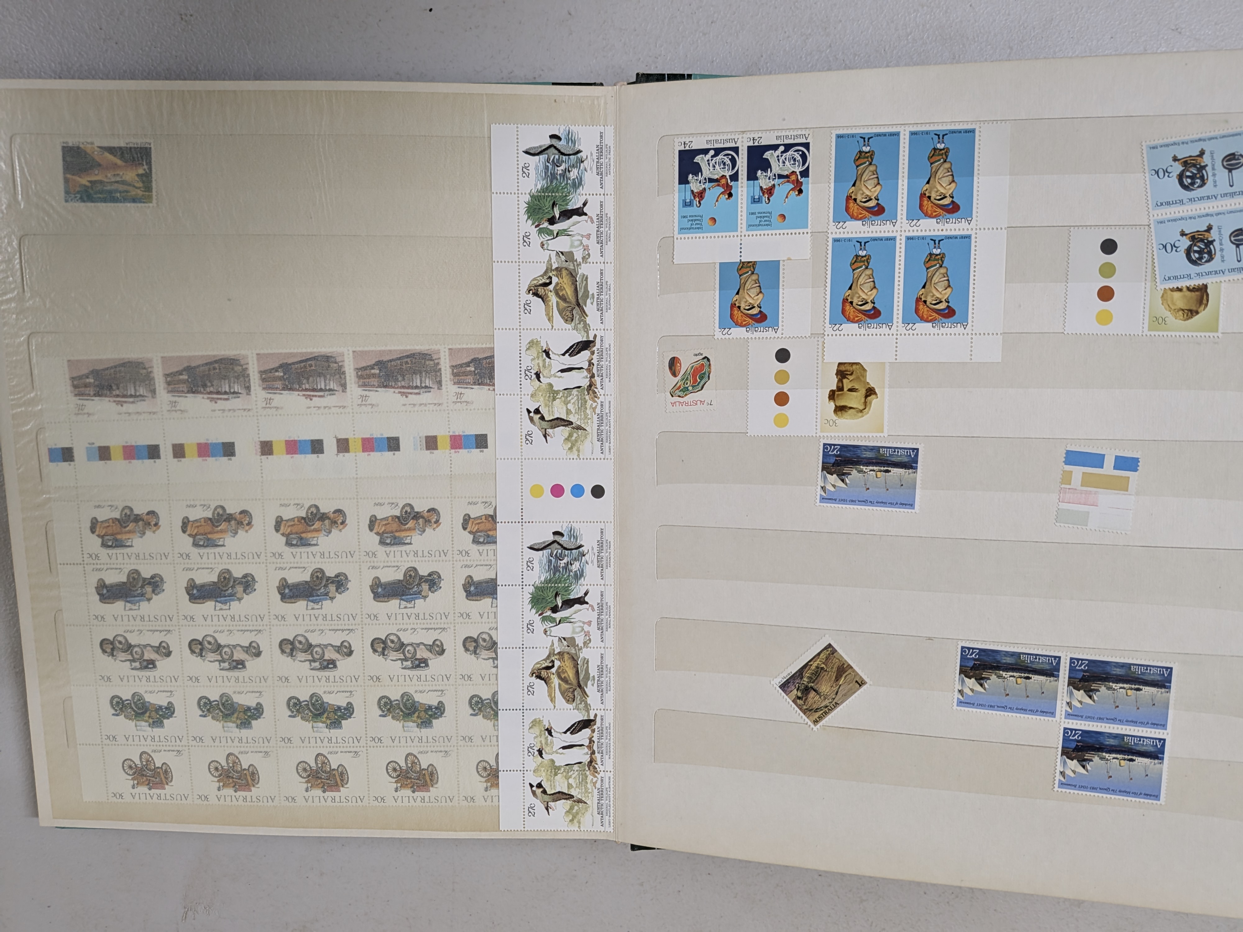 A vintage 'Mint' brand stamp album with a teal hardback cover and gold lettering, filled with a diverse collection of Australian postage stamps from the mid-to-late 20th century. - View 4