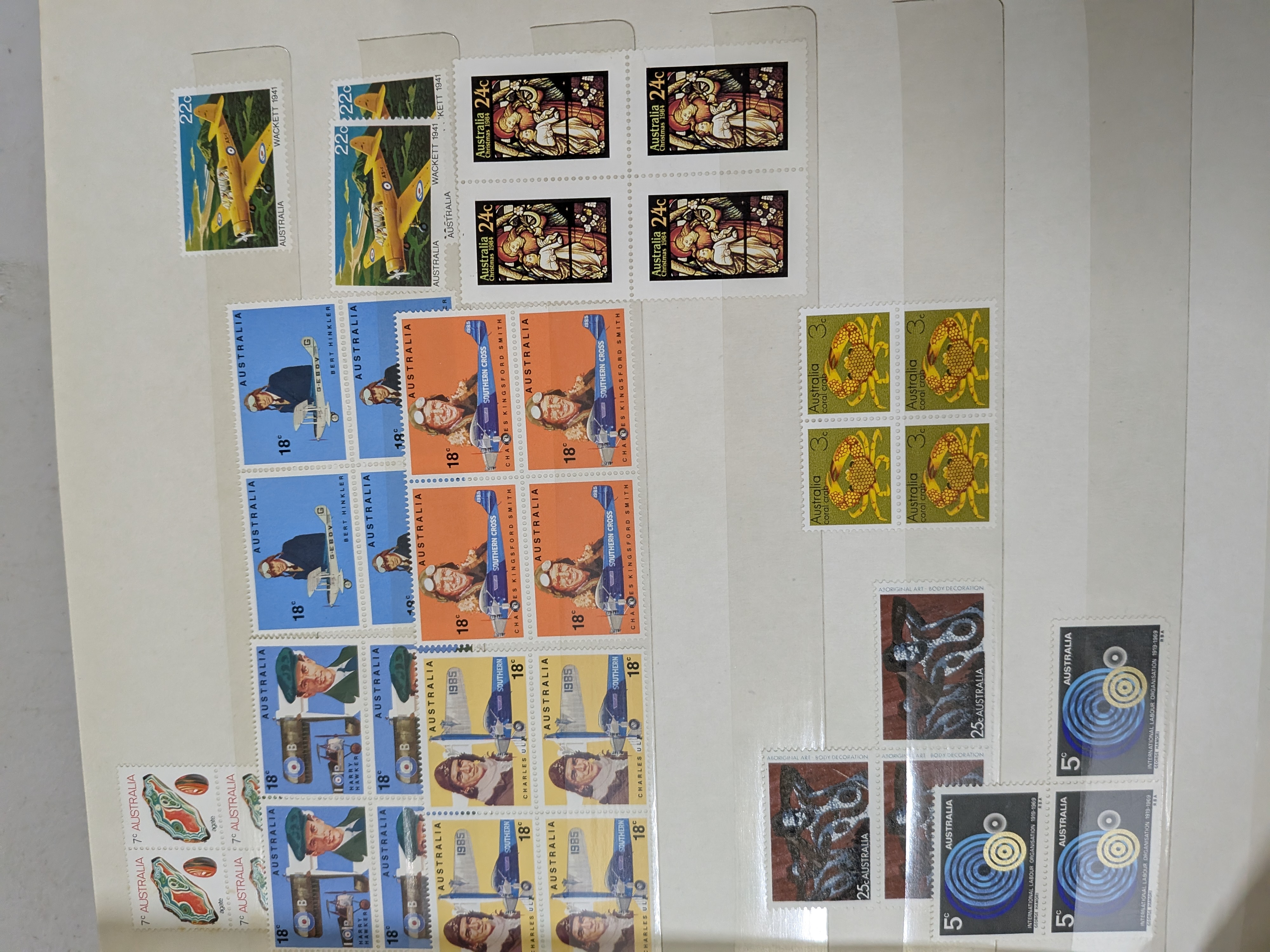 A vintage 'Mint' brand stamp album with a teal hardback cover and gold lettering, filled with a diverse collection of Australian postage stamps from the mid-to-late 20th century. - View 7