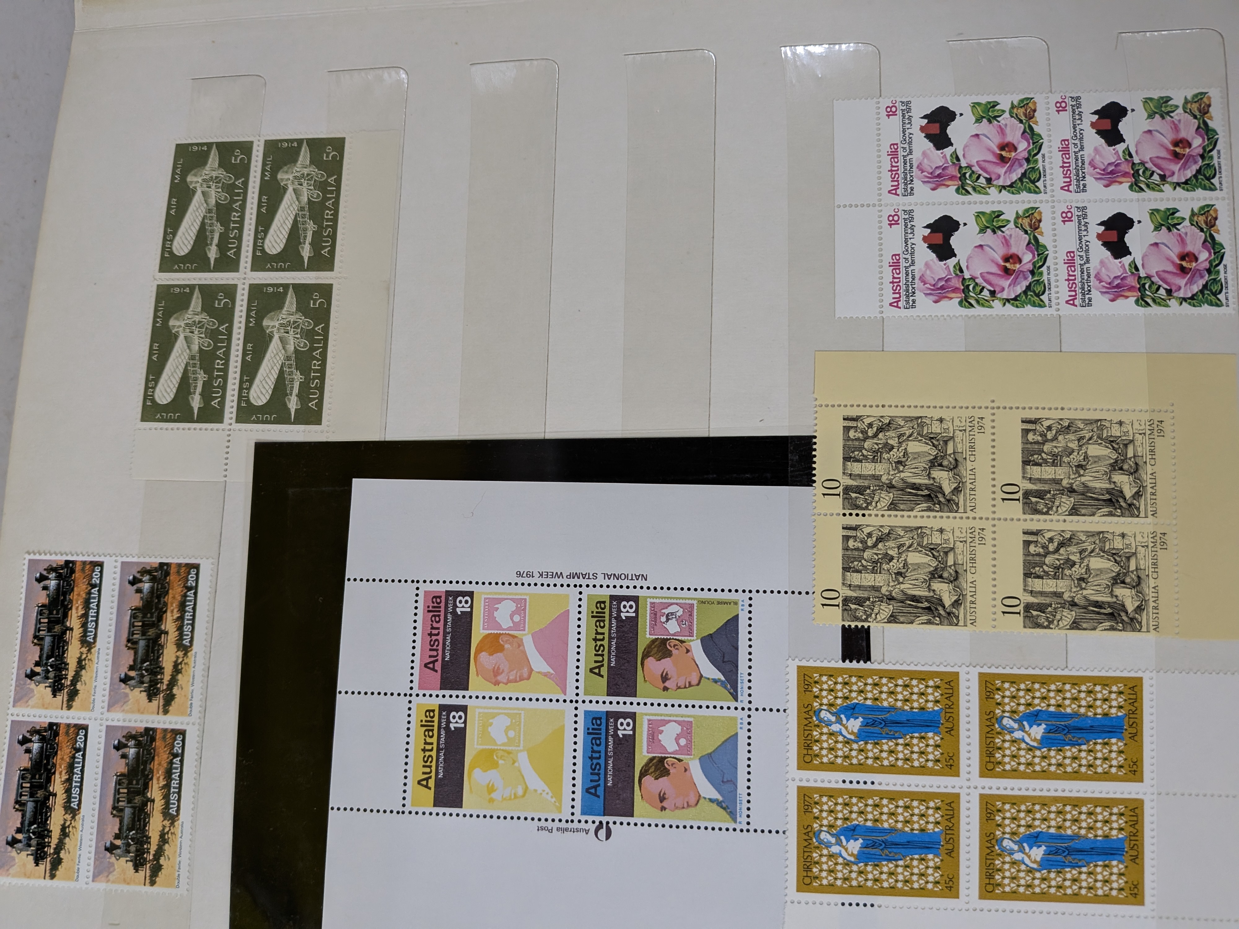 A vintage 'Mint' brand stamp album with a teal hardback cover and gold lettering, filled with a diverse collection of Australian postage stamps from the mid-to-late 20th century. - View 8