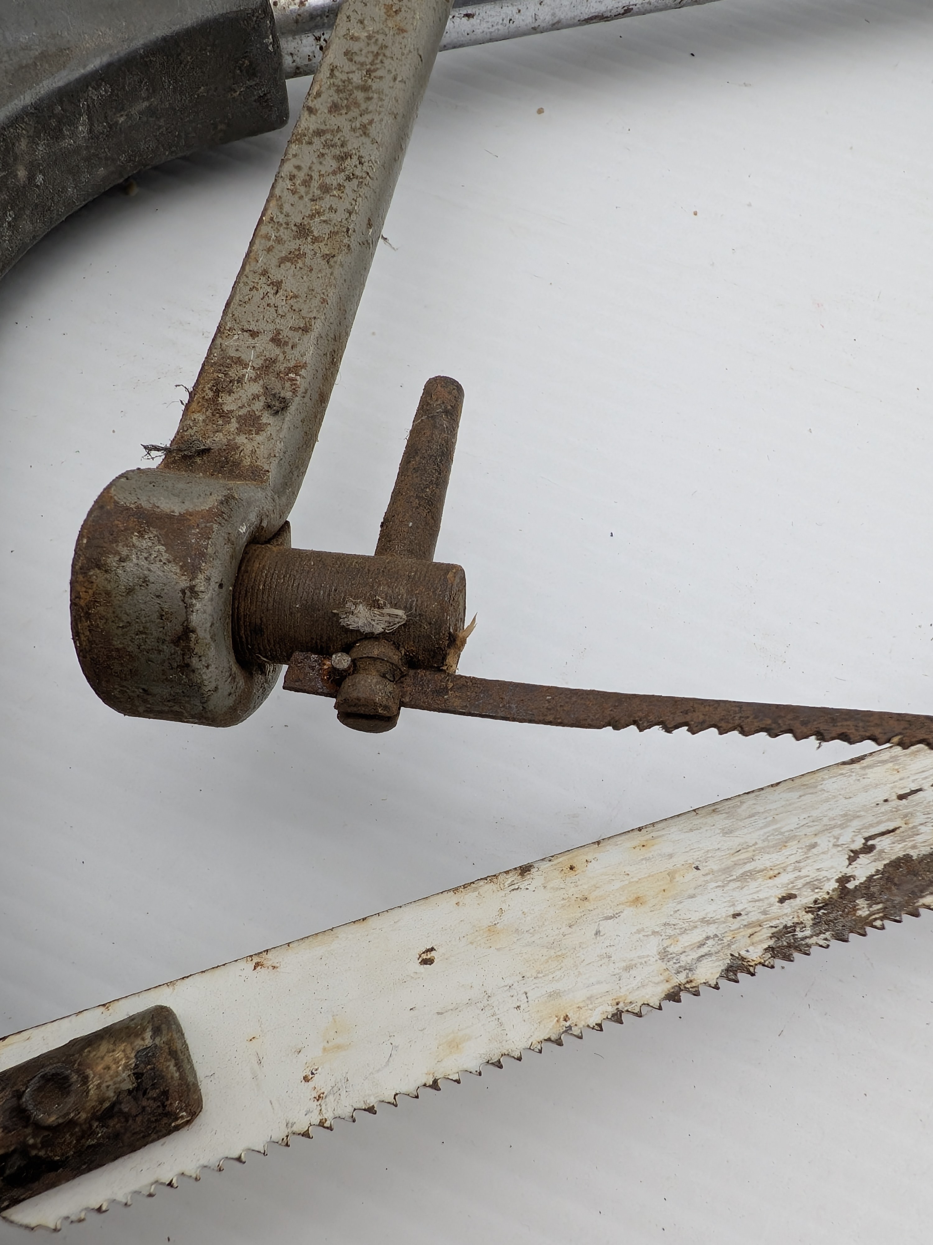 A collection of vintage Australian hand tools, including an Eclipse hacksaw, a bow saw, and a Wiltshire file, all showing significant signs of age and use. - View 2