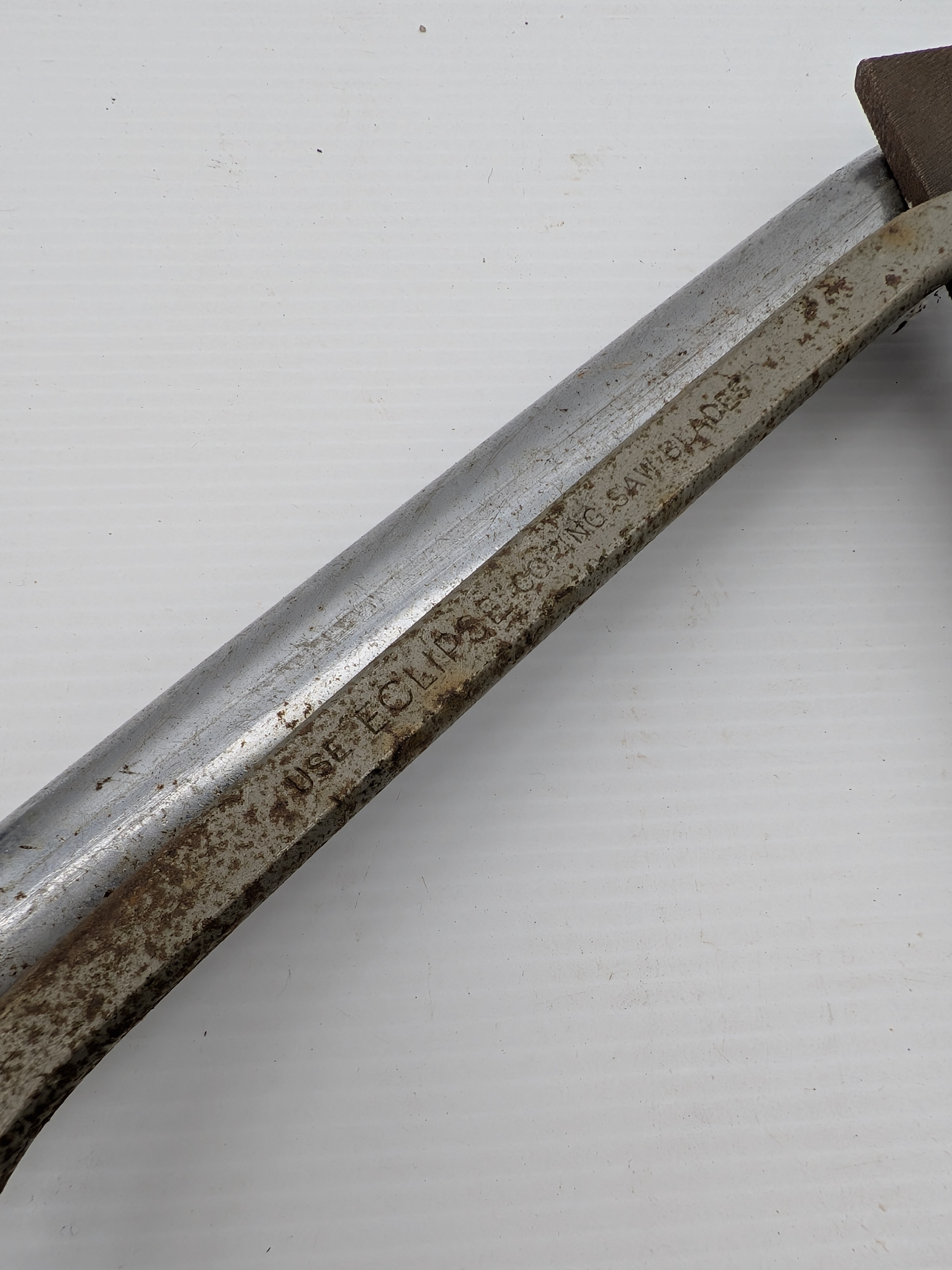 A collection of vintage Australian hand tools, including an Eclipse hacksaw, a bow saw, and a Wiltshire file, all showing significant signs of age and use. - View 7