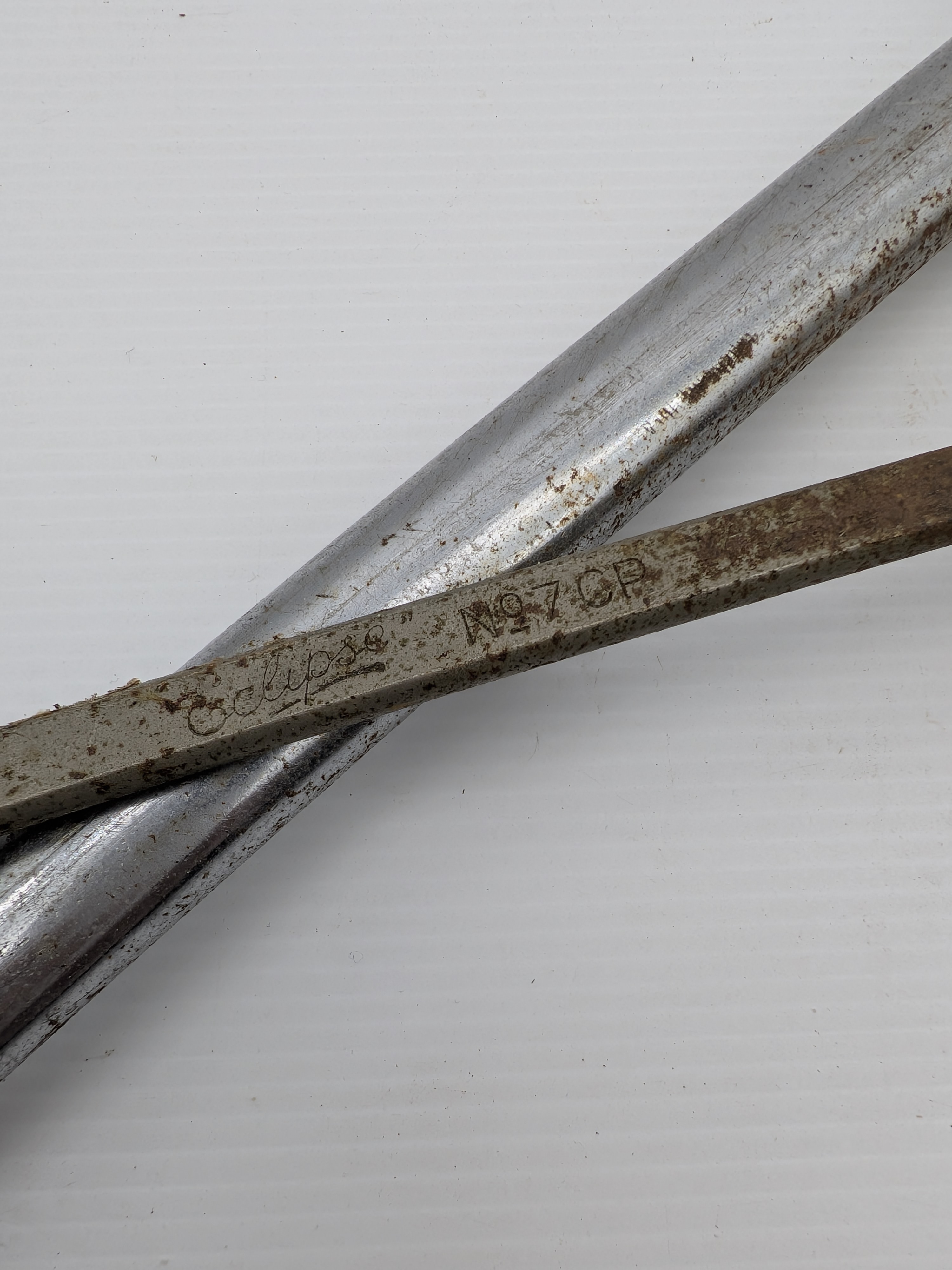 A collection of vintage Australian hand tools, including an Eclipse hacksaw, a bow saw, and a Wiltshire file, all showing significant signs of age and use. - View 8