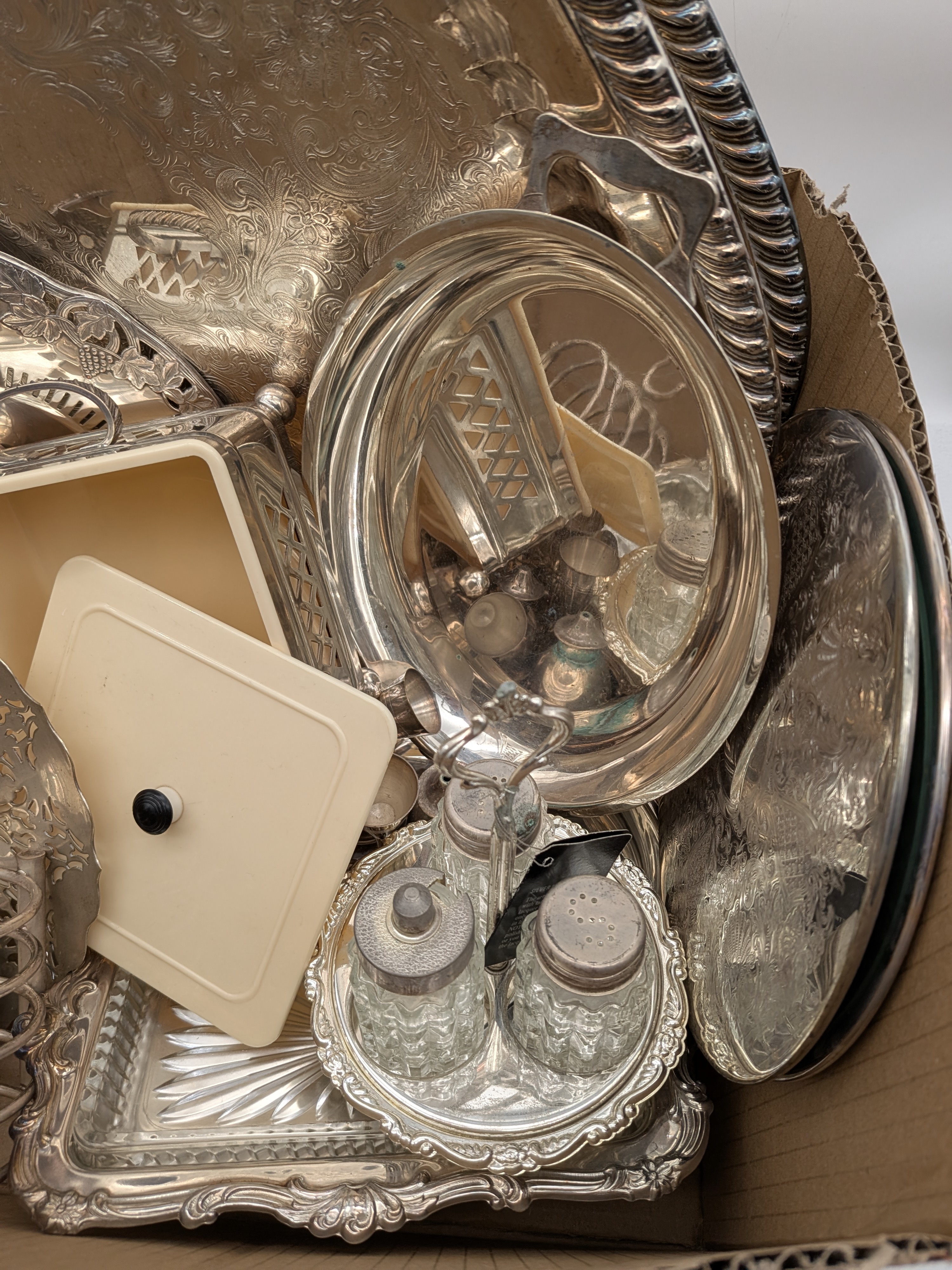 A diverse collection of vintage silver-plated homewares, including serving trays, dishes, and condiment sets, primarily from the mid-20th century. - View 3