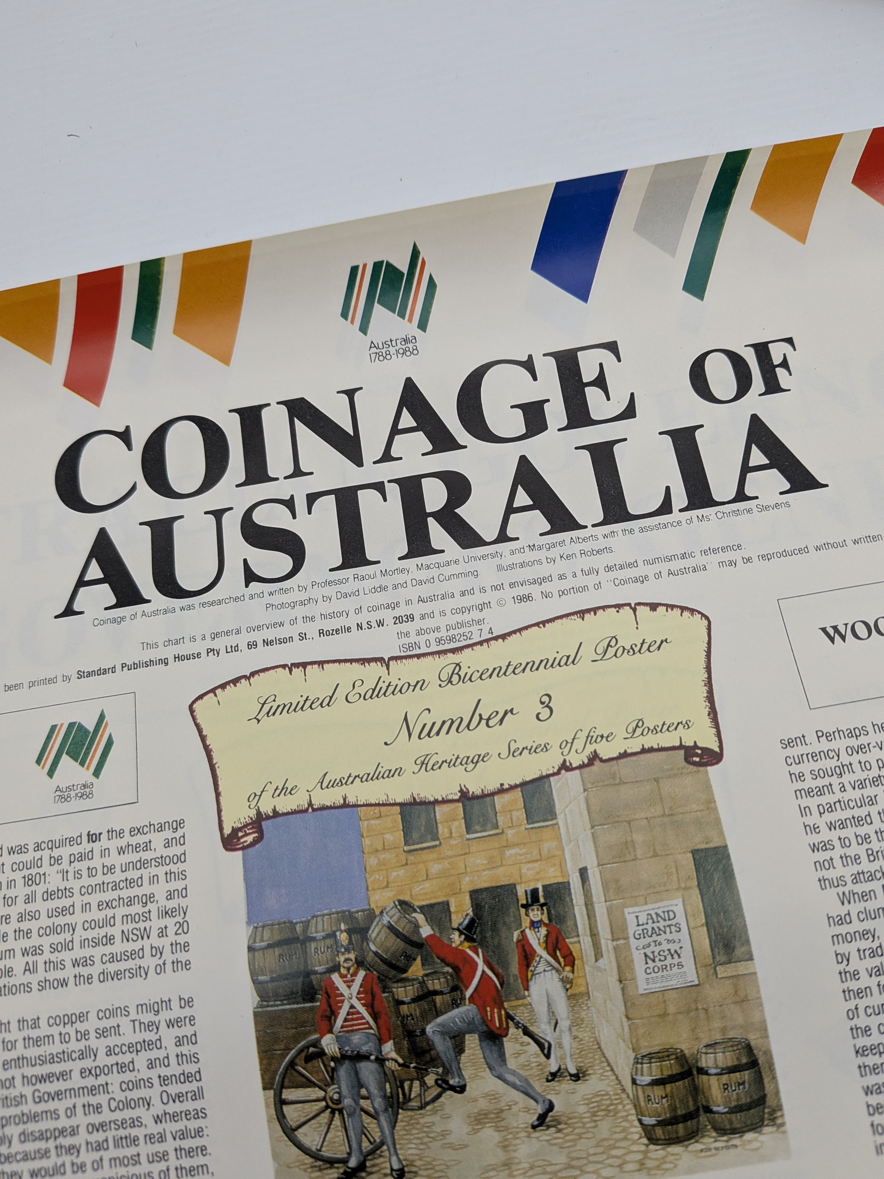 A collection of rolled canvases including a signed 1973 painting of a coastal scene and two Australian Bicentennial posters from 1988. - View 6