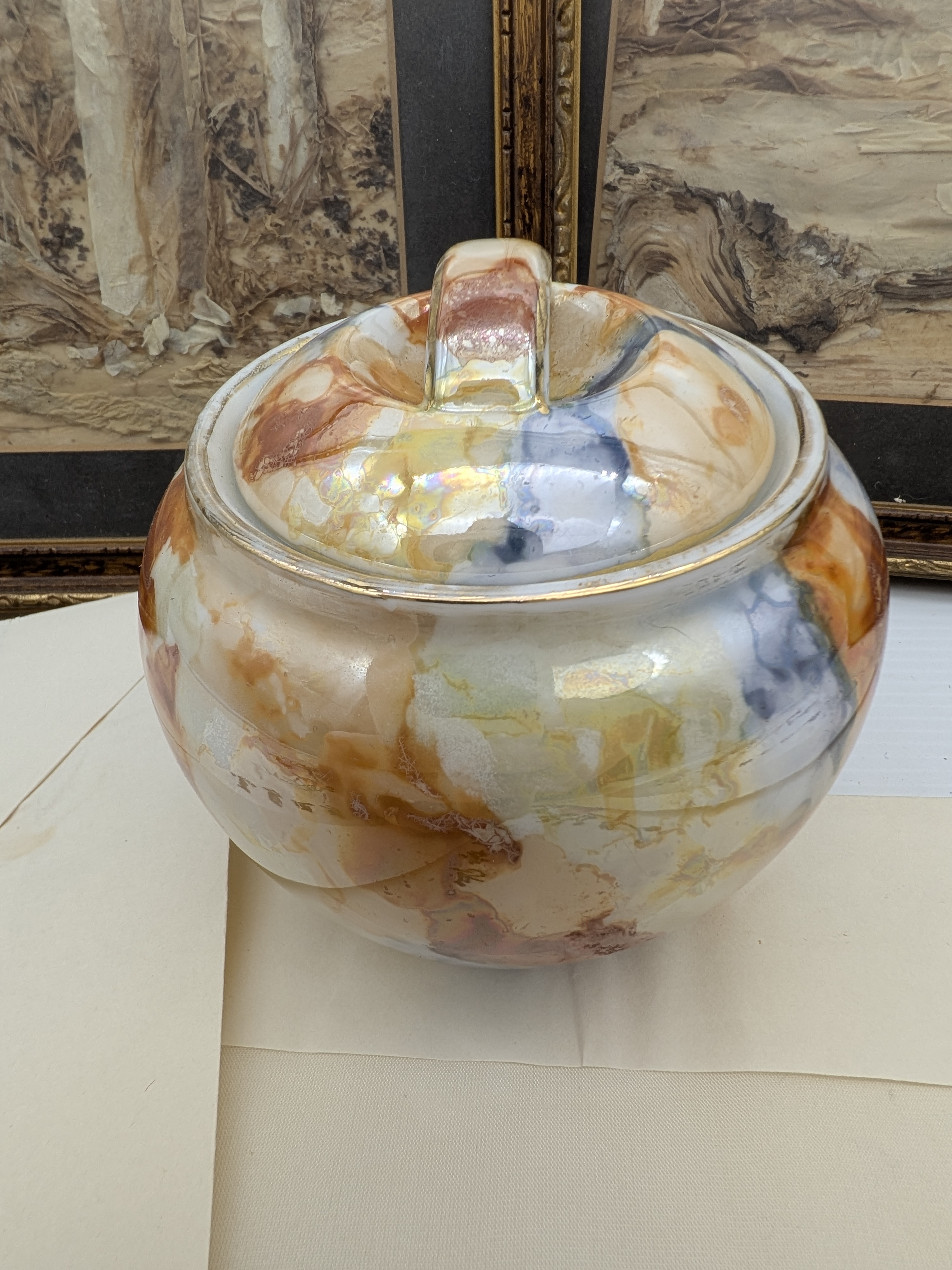 A diverse collection featuring two framed relief artworks, several embroidered silk panels depicting birds and floral motifs, and a small decorative lidded ceramic pot. - View 7