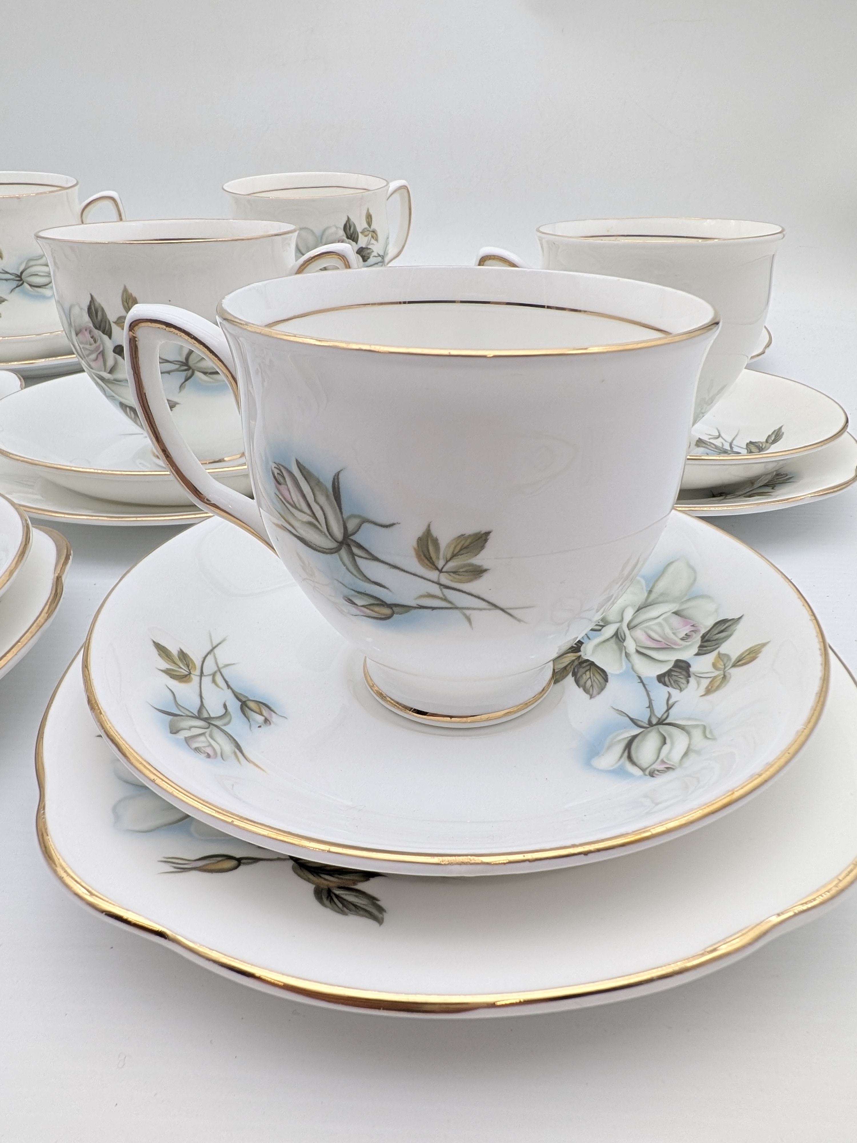 Duchess Bone China 'Blue Rose' Tea Set, 7 Trios — Lot 054, photograph 2