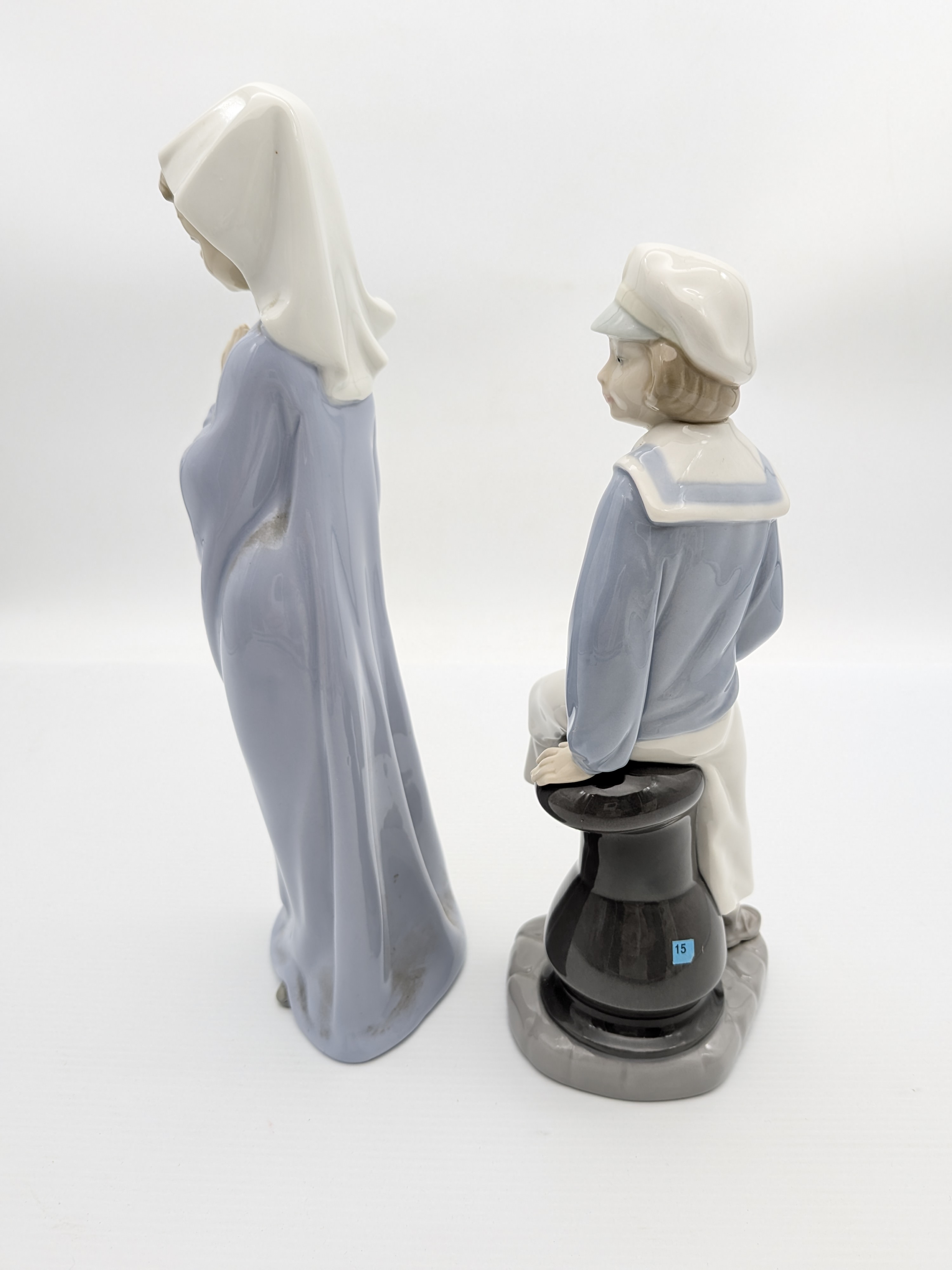 Two Lladro Porcelain Figurines: Praying Girl and Sailor with Boat — Lot 059, photograph 2