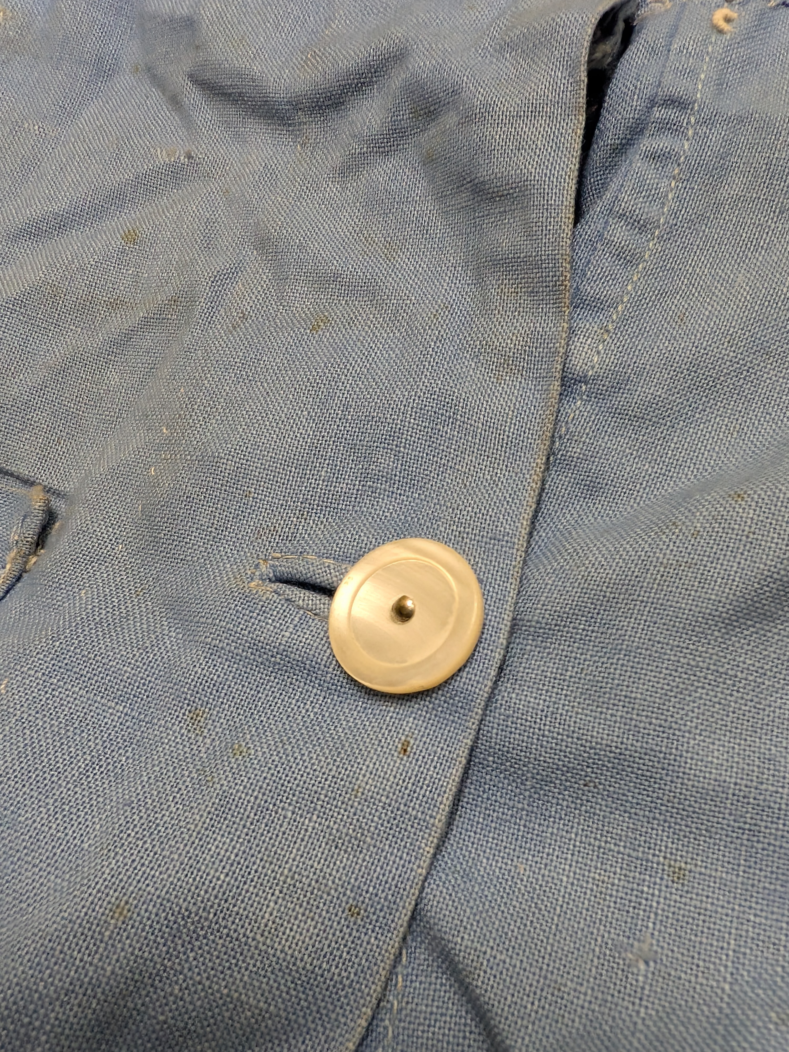 A vintage light blue nurse's uniform dress with a white collar and a red cross emblem, likely from the mid-20th century, made of cotton blend fabric. - View 5