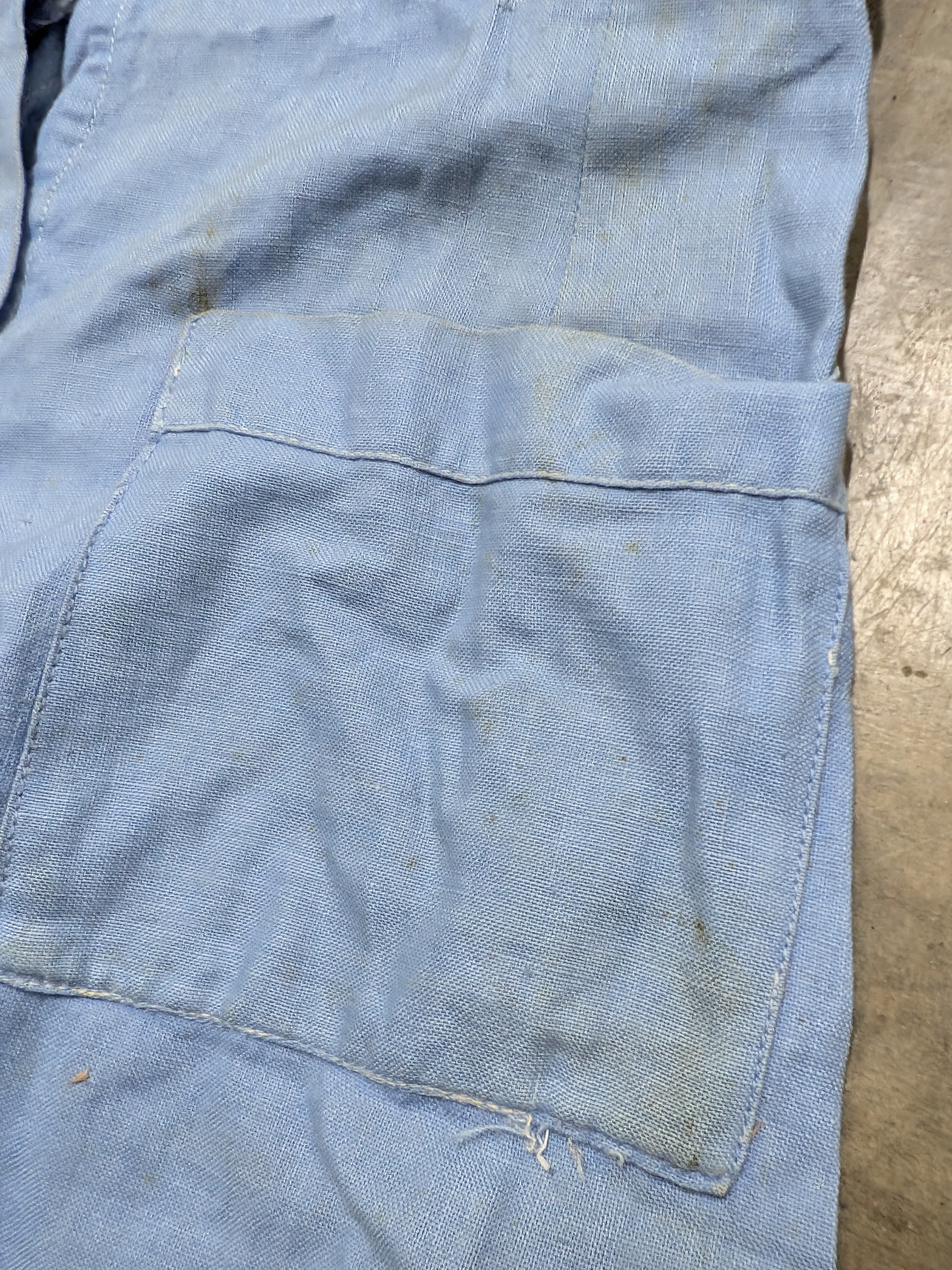 A vintage light blue nurse's uniform dress with a white collar and a red cross emblem, likely from the mid-20th century, made of cotton blend fabric. - View 6