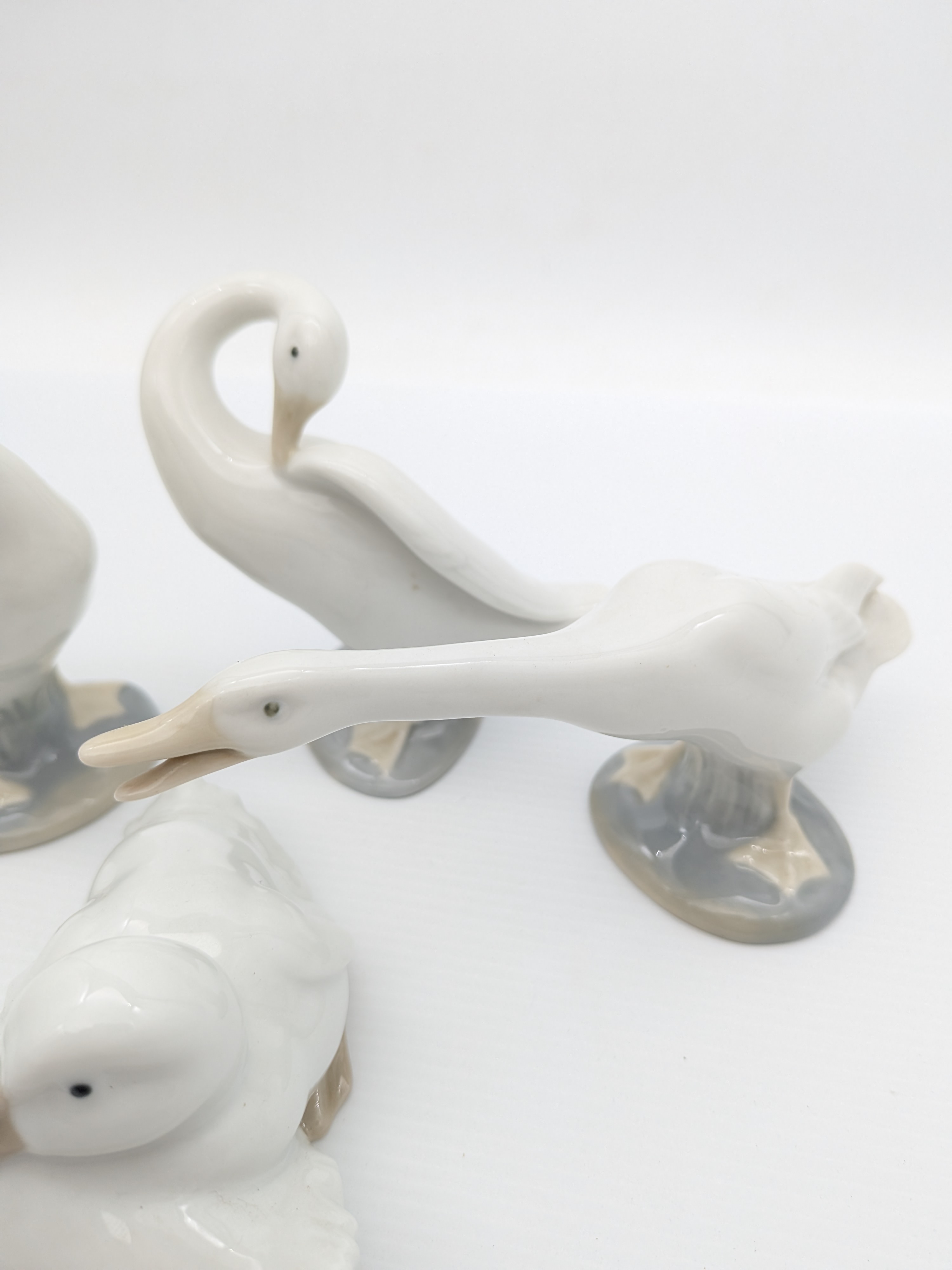 Set of Four Nao by Lladró Porcelain Geese Figurines, 1990's — Lot 066, photograph 3