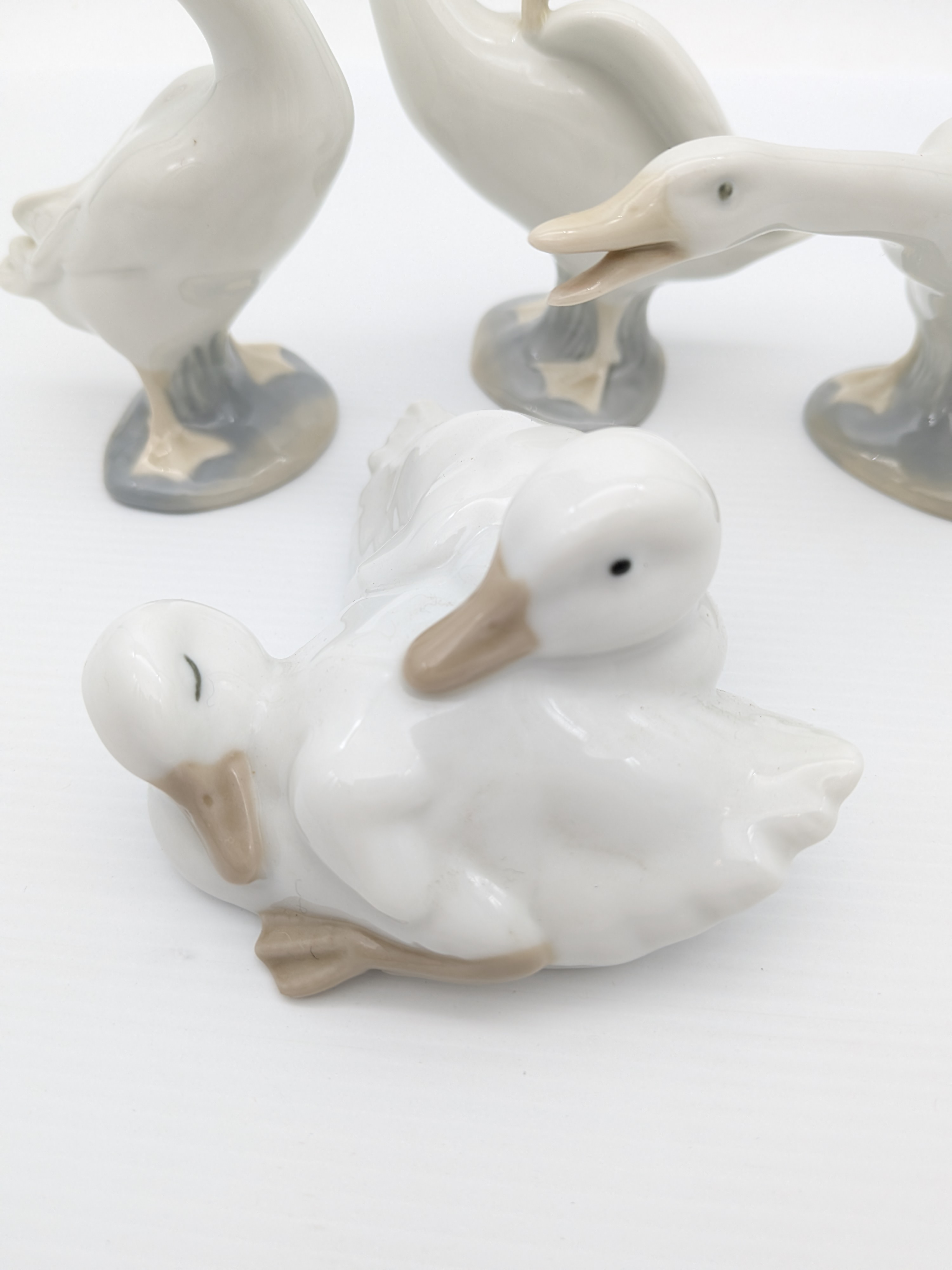 Set of Four Nao by Lladró Porcelain Geese Figurines, 1990's — Lot 066, photograph 4