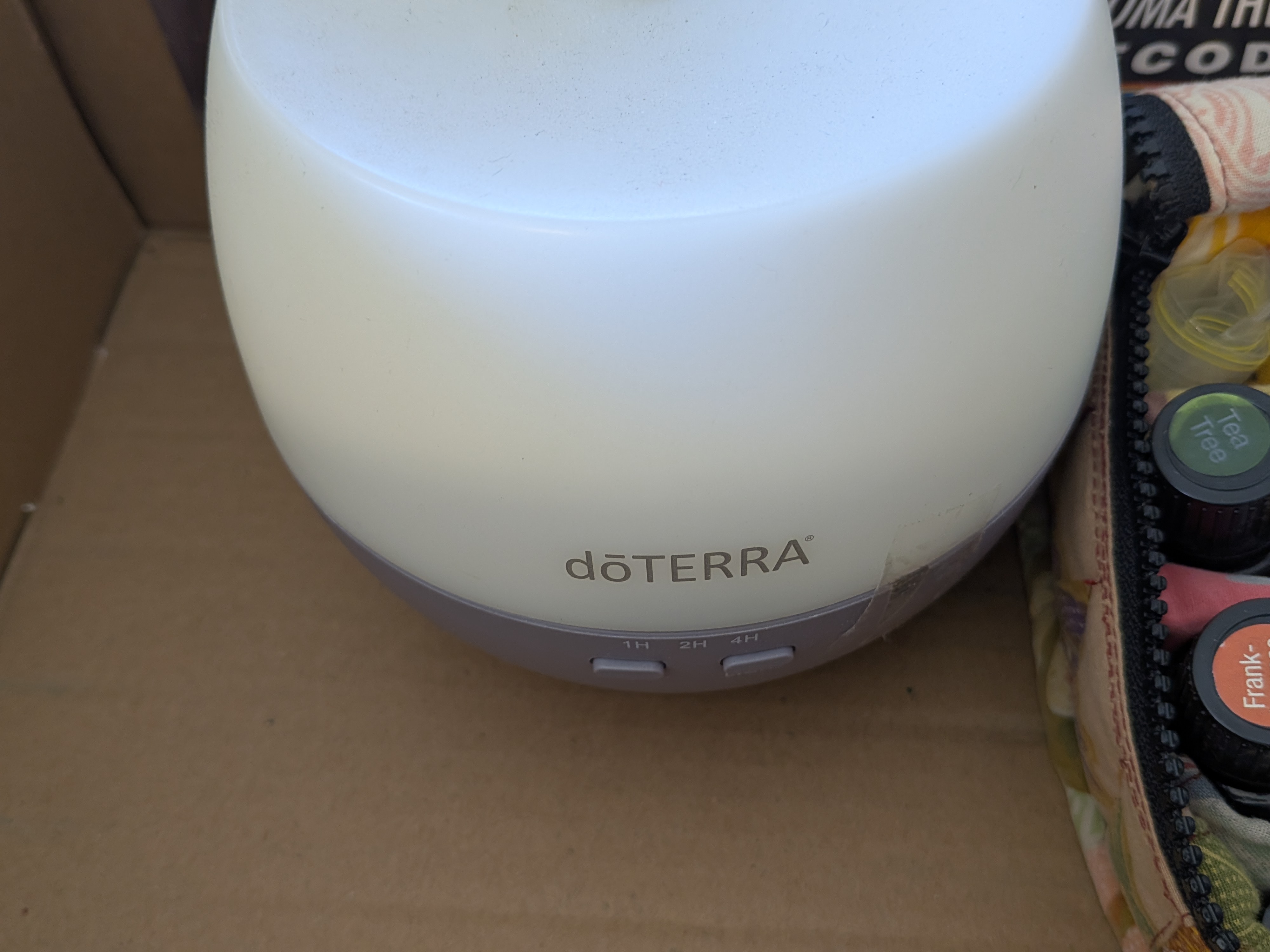 Lot of doTERRA Essential Oils and Diffuser with Sundries — Lot 082, photograph 2