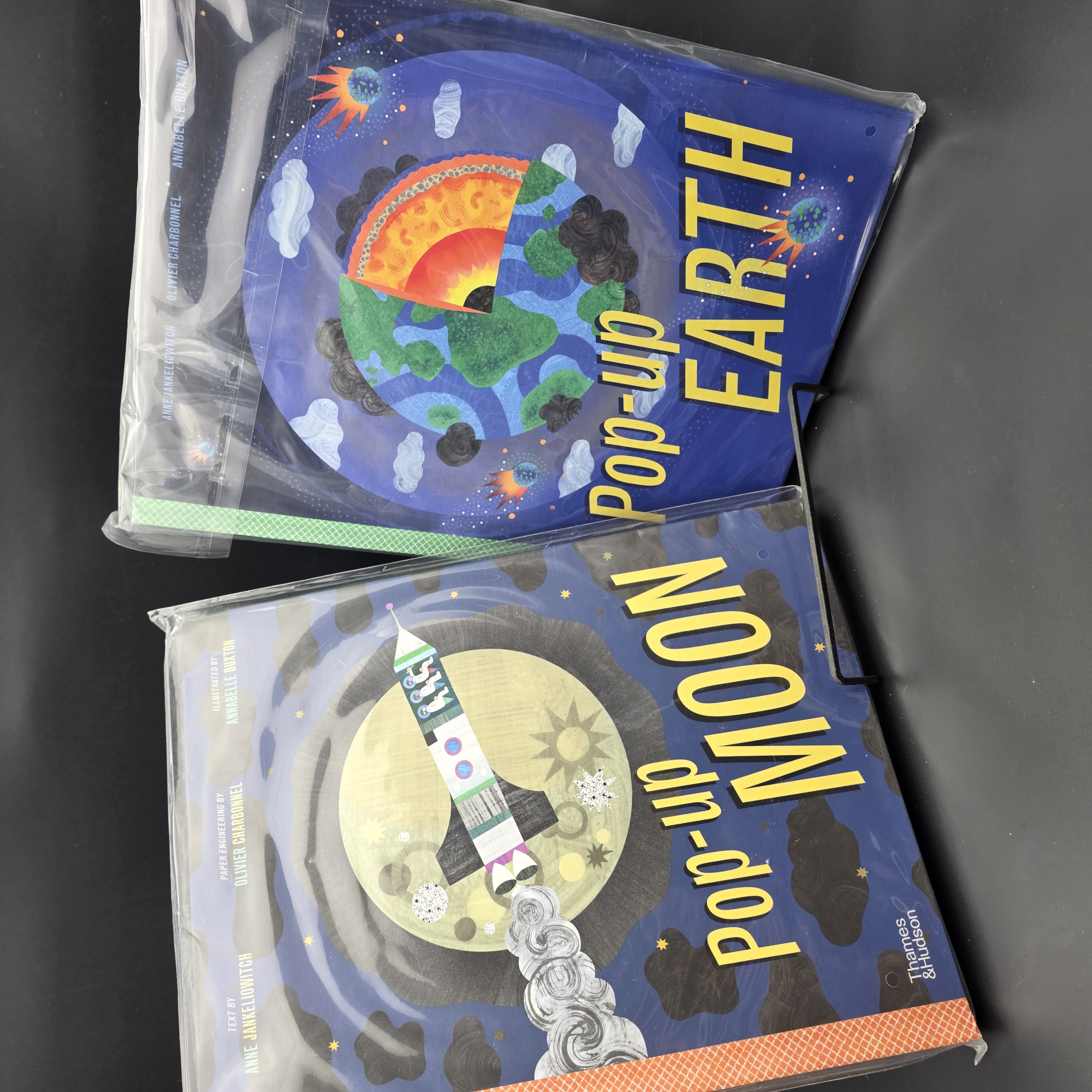 A Pair of New Sealed Pop-up Books: "Pop-up Moon" & "Pop-up Earth" — Lot 048, photograph 1