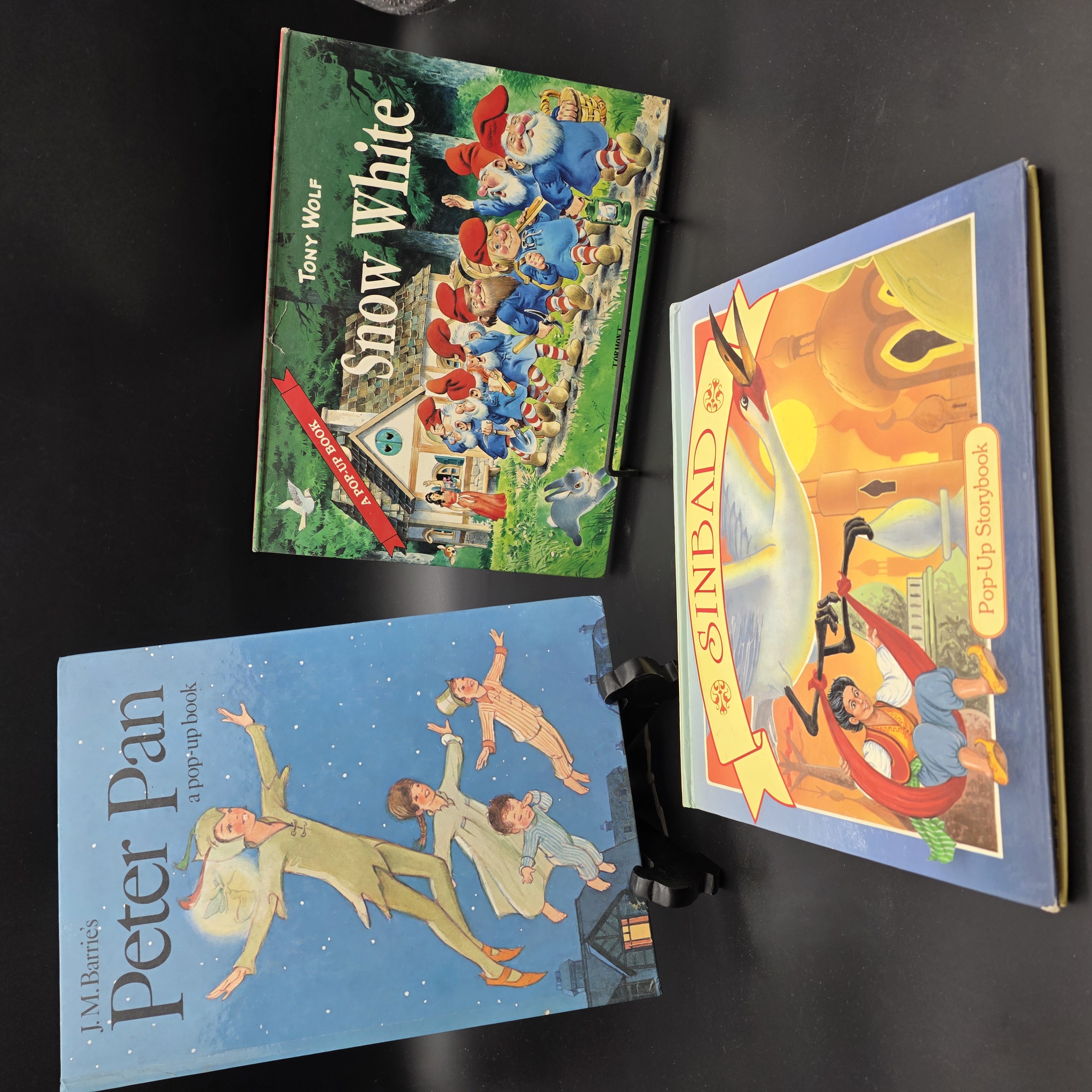 Lot of Three Vintage Pop-Up Children's Books: Peter Pan, Snow White, and Sinbad — Lot 066, photograph 1