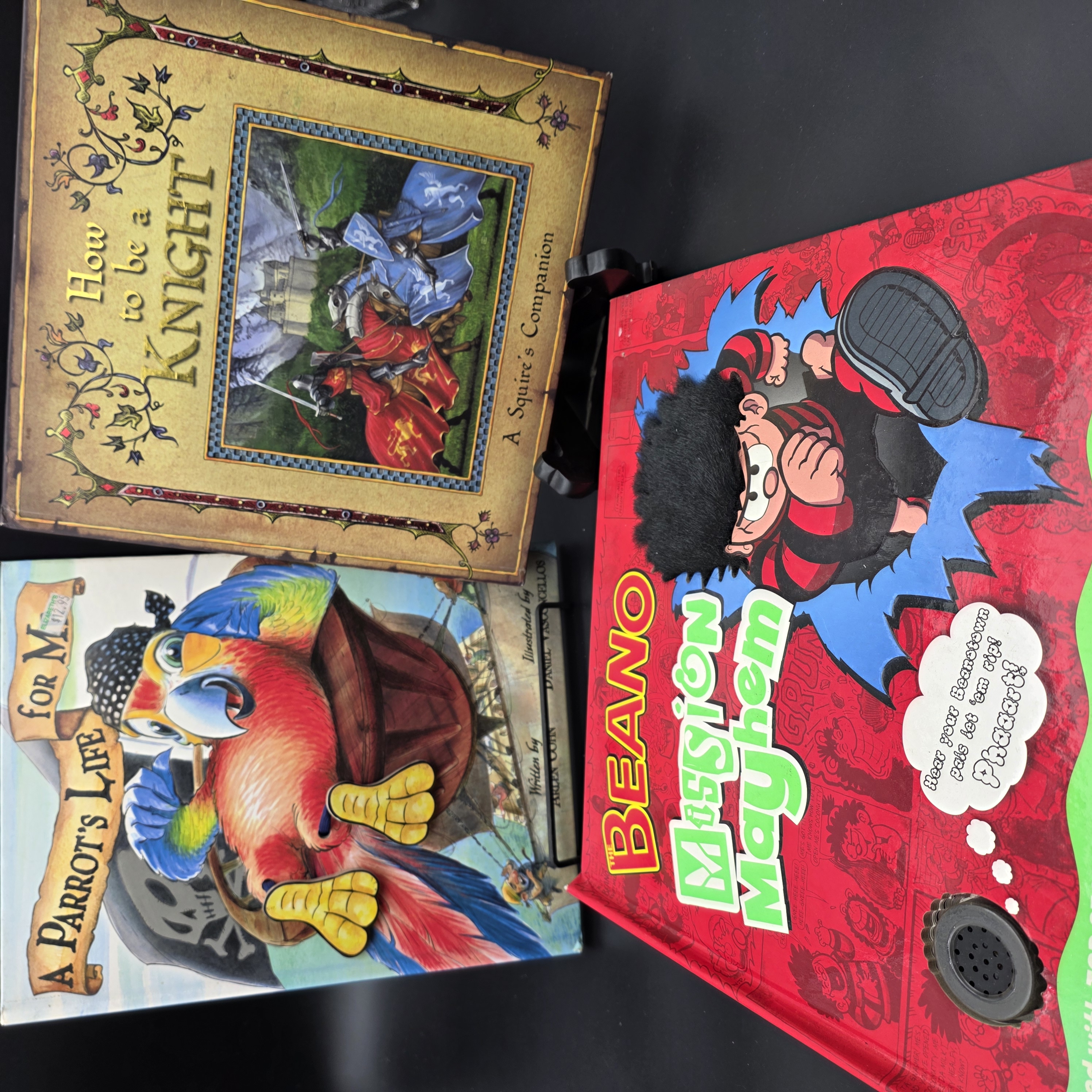Lot of Three Children's Interactive & Pop-Up Books: Beano, Parrot, Knight — Lot 098, photograph 1