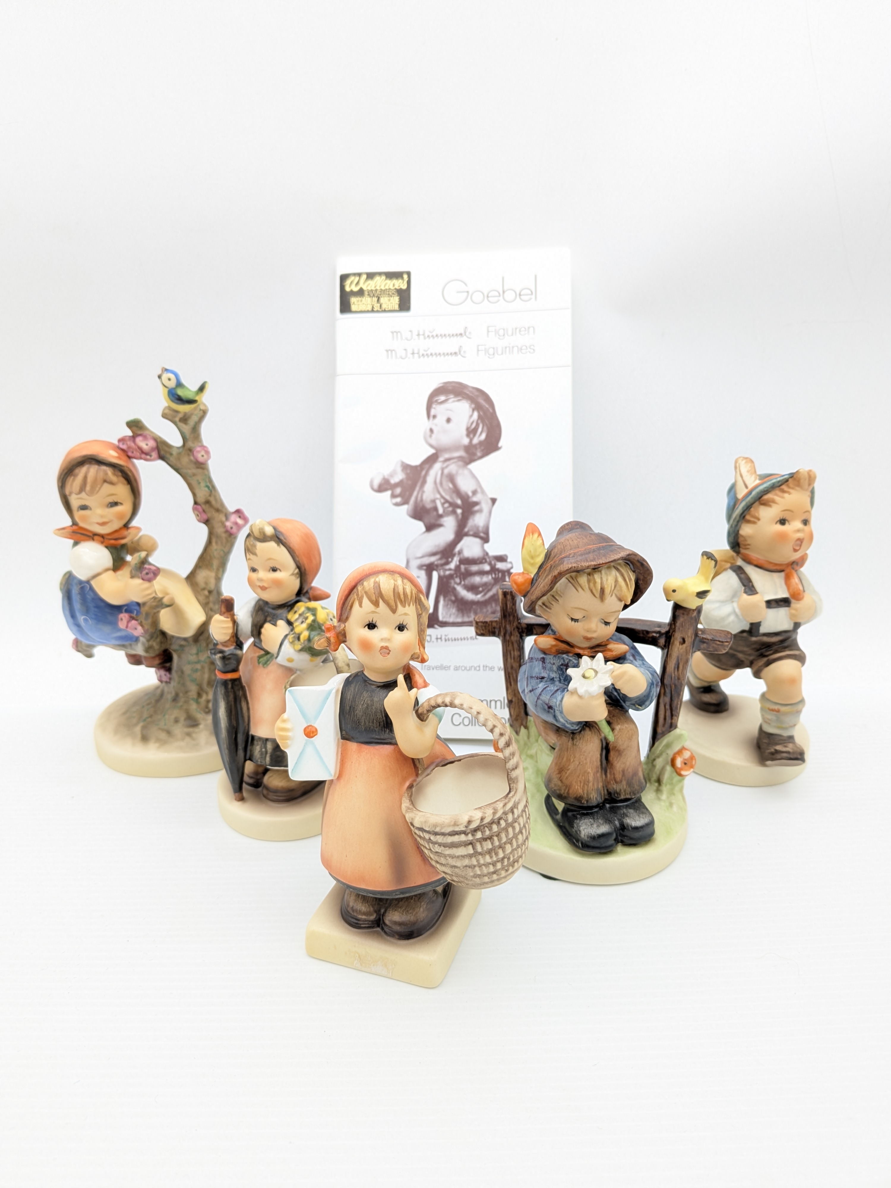 Collection of Five Goebel M.J. Hummel Porcelain Figurines with Catalogue — Lot 048