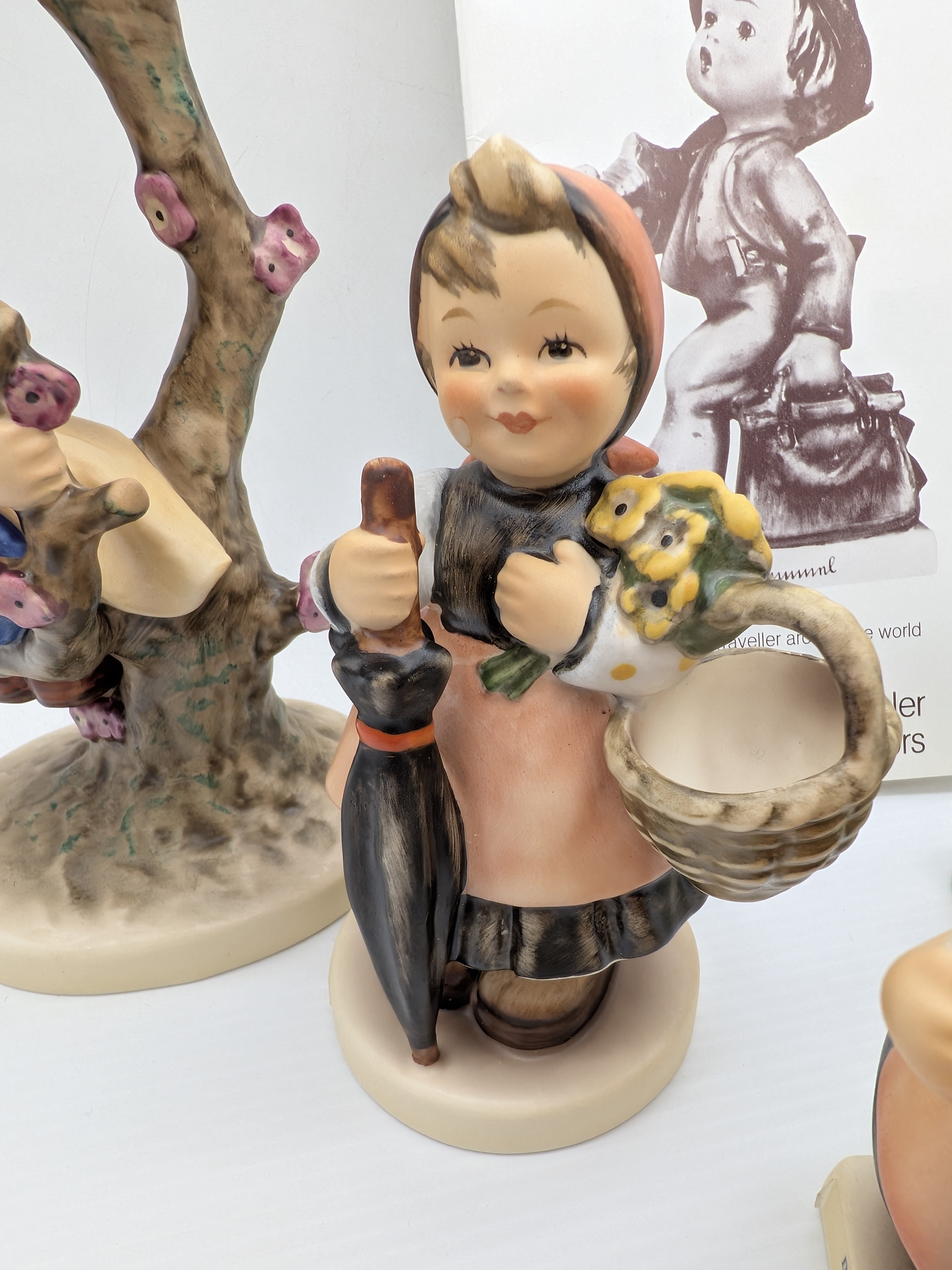Collection of Five Goebel M.J. Hummel Porcelain Figurines with Catalogue — Lot 048, photograph 3