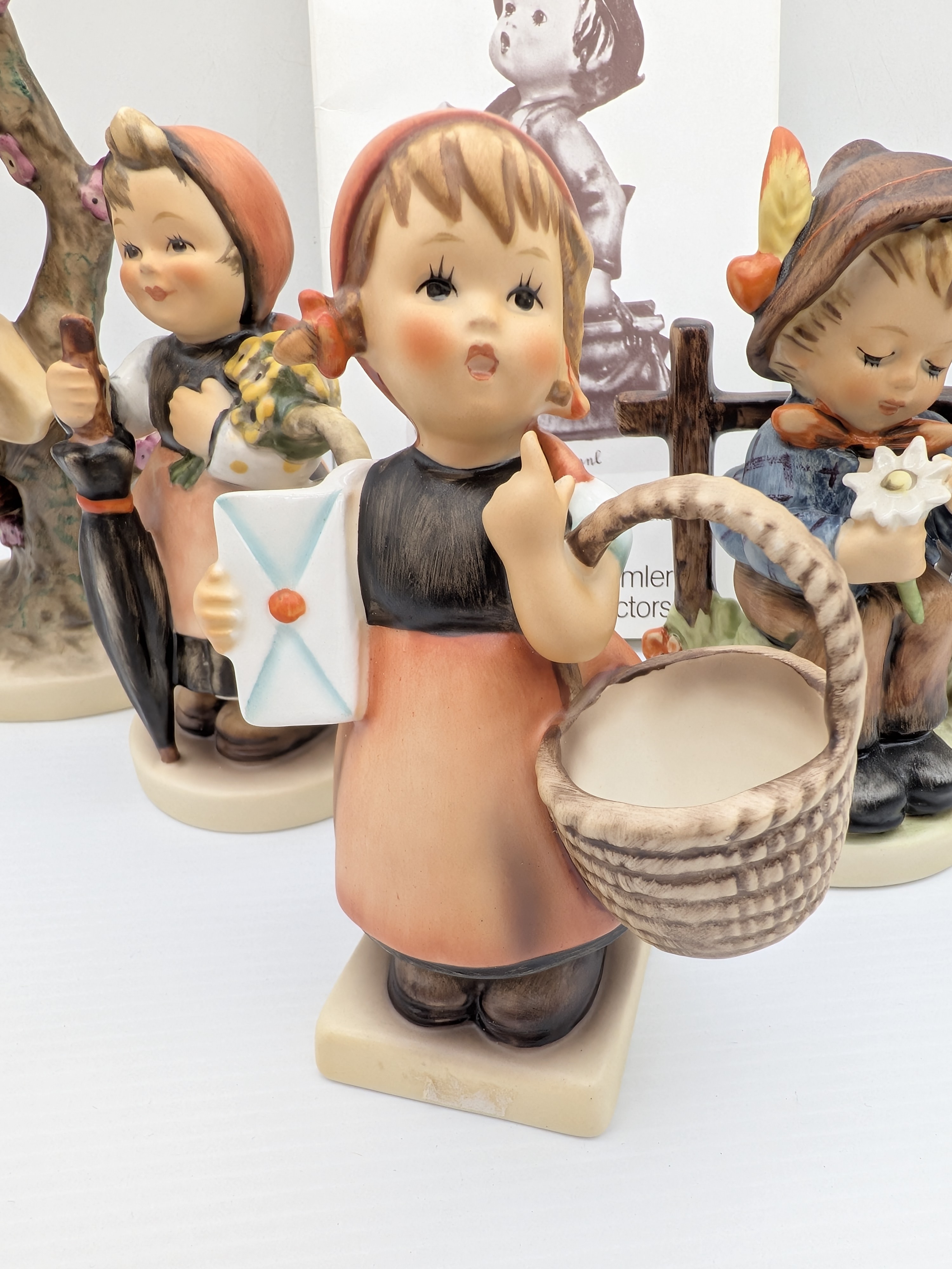 Collection of Five Goebel M.J. Hummel Porcelain Figurines with Catalogue — Lot 048, photograph 4
