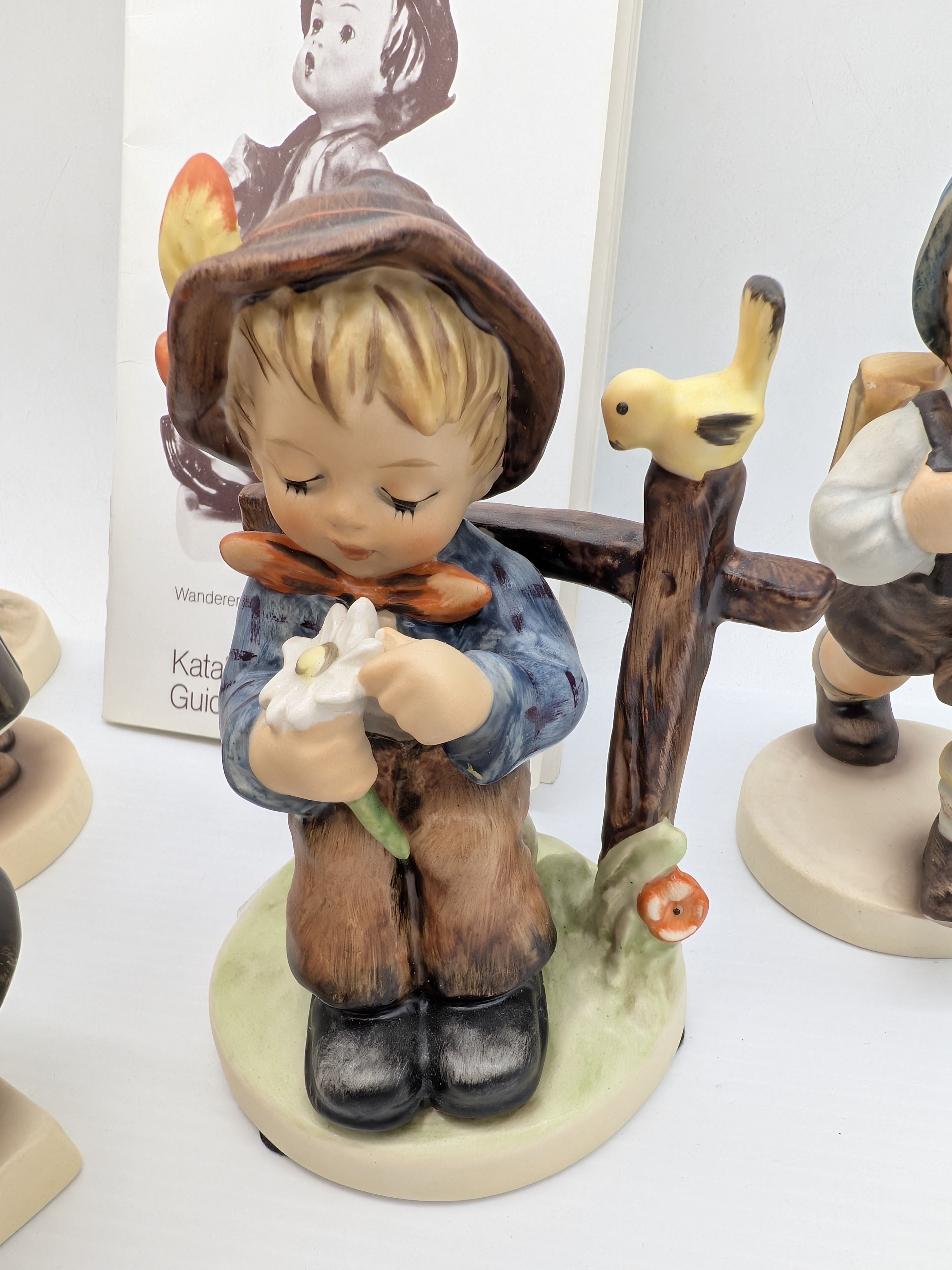 Collection of Five Goebel M.J. Hummel Porcelain Figurines with Catalogue — Lot 048, photograph 5