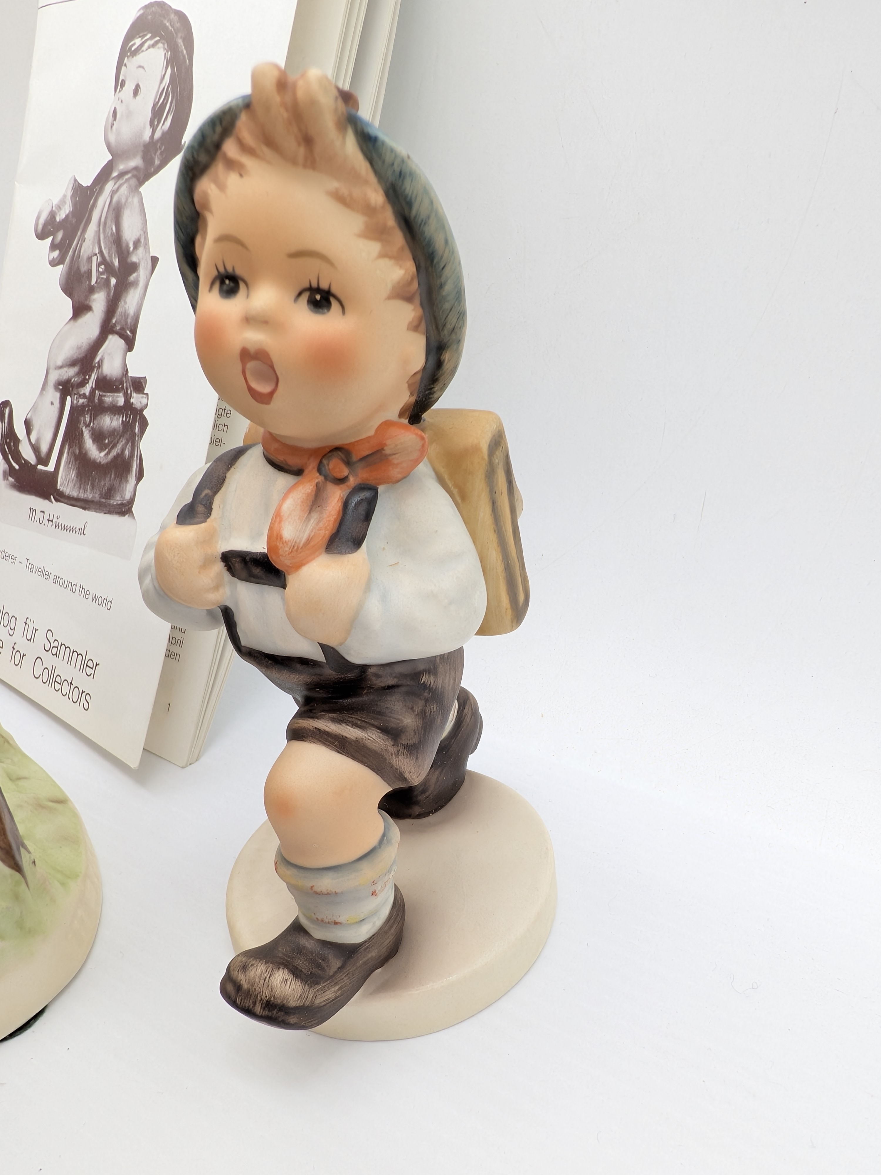 Collection of Five Goebel M.J. Hummel Porcelain Figurines with Catalogue — Lot 048, photograph 6