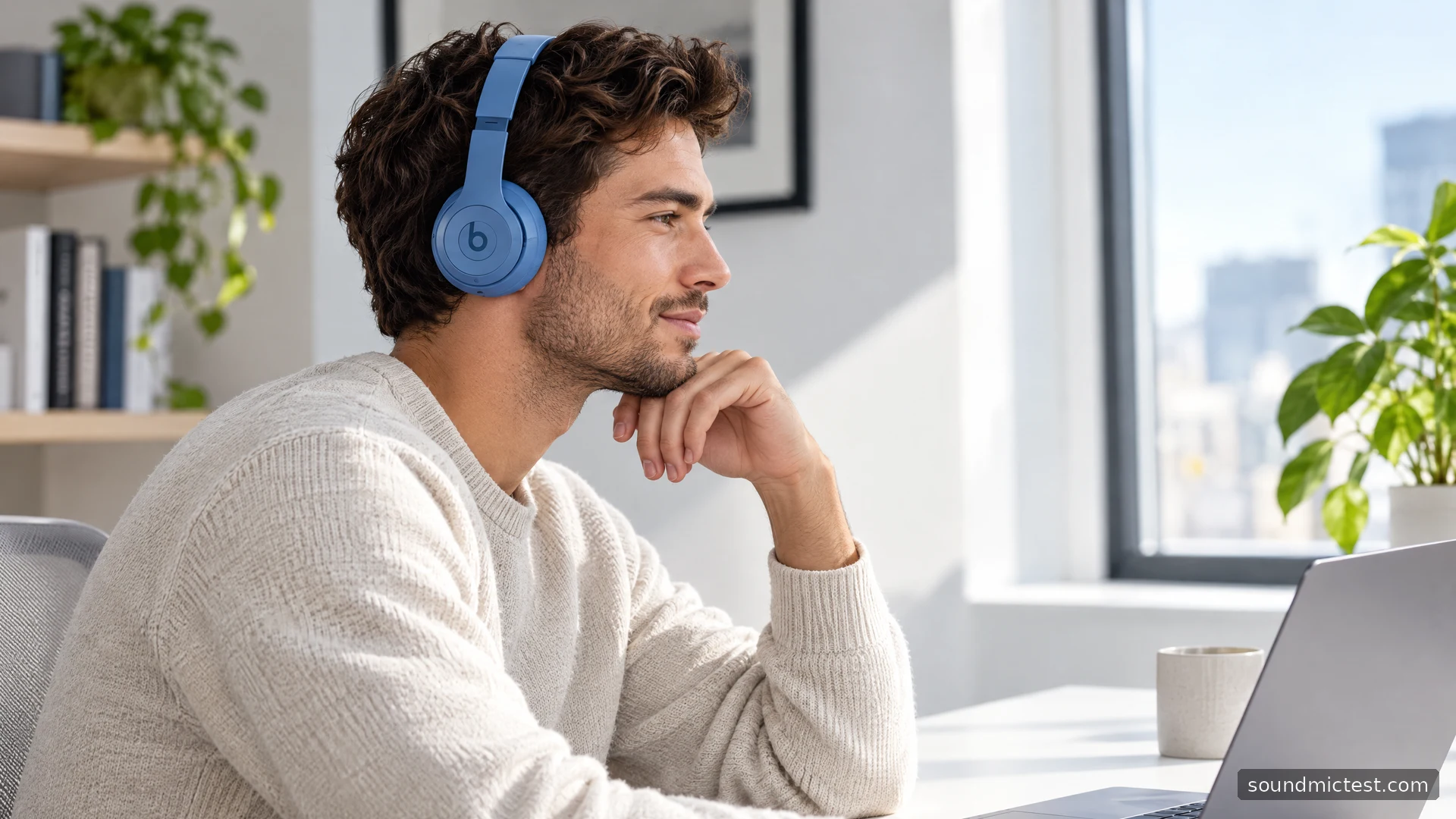 Blue Beats Solo 4 worn at a bright white office desk