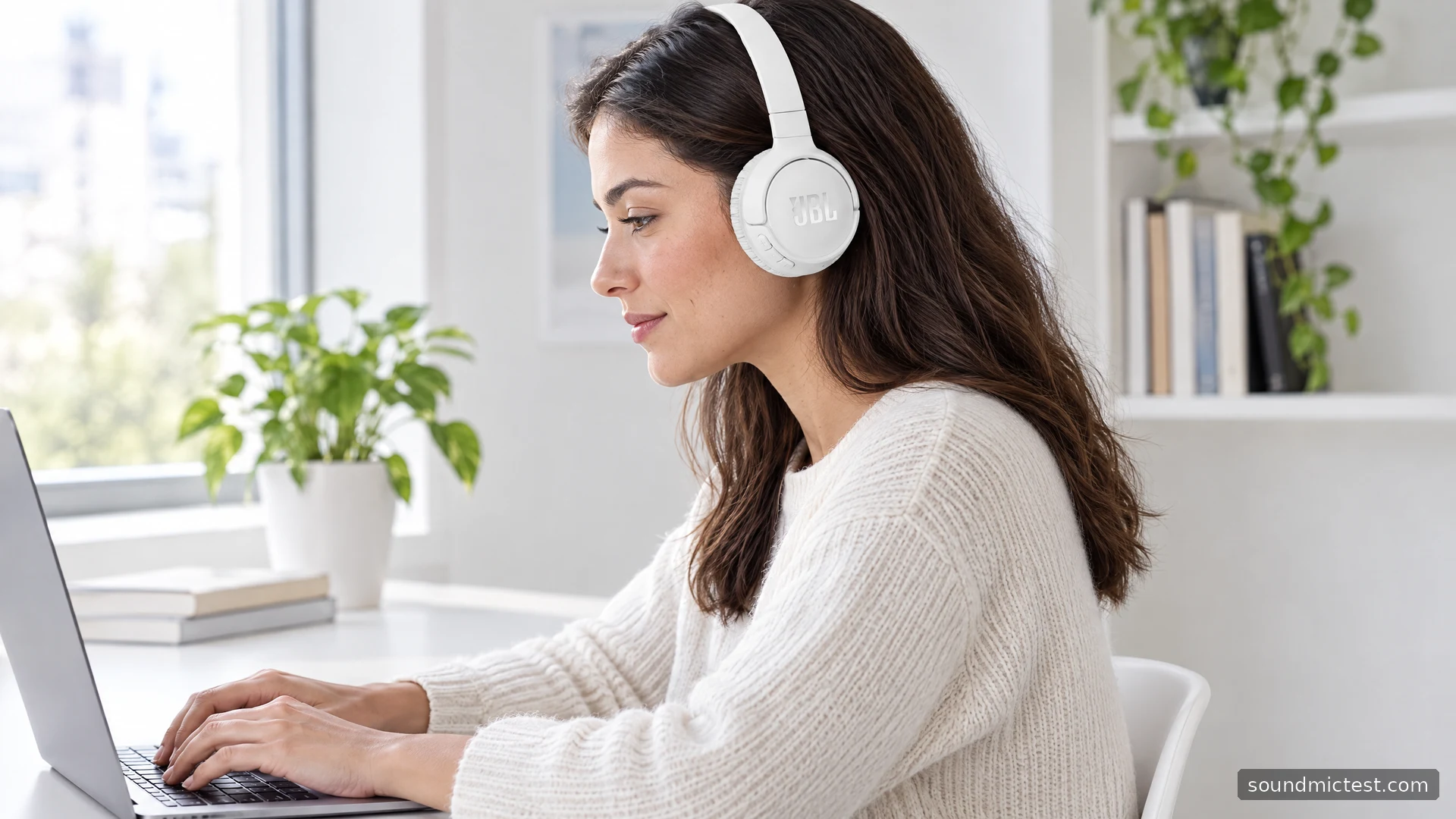 White JBL Tune 510BT worn at a bright white office desk